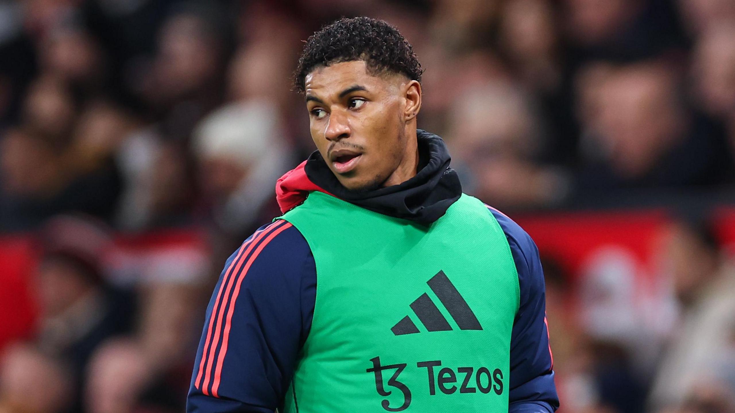 Marcus Rashford warming up on the sidelines during Manchester United's 2-0 defeat by Newcastle