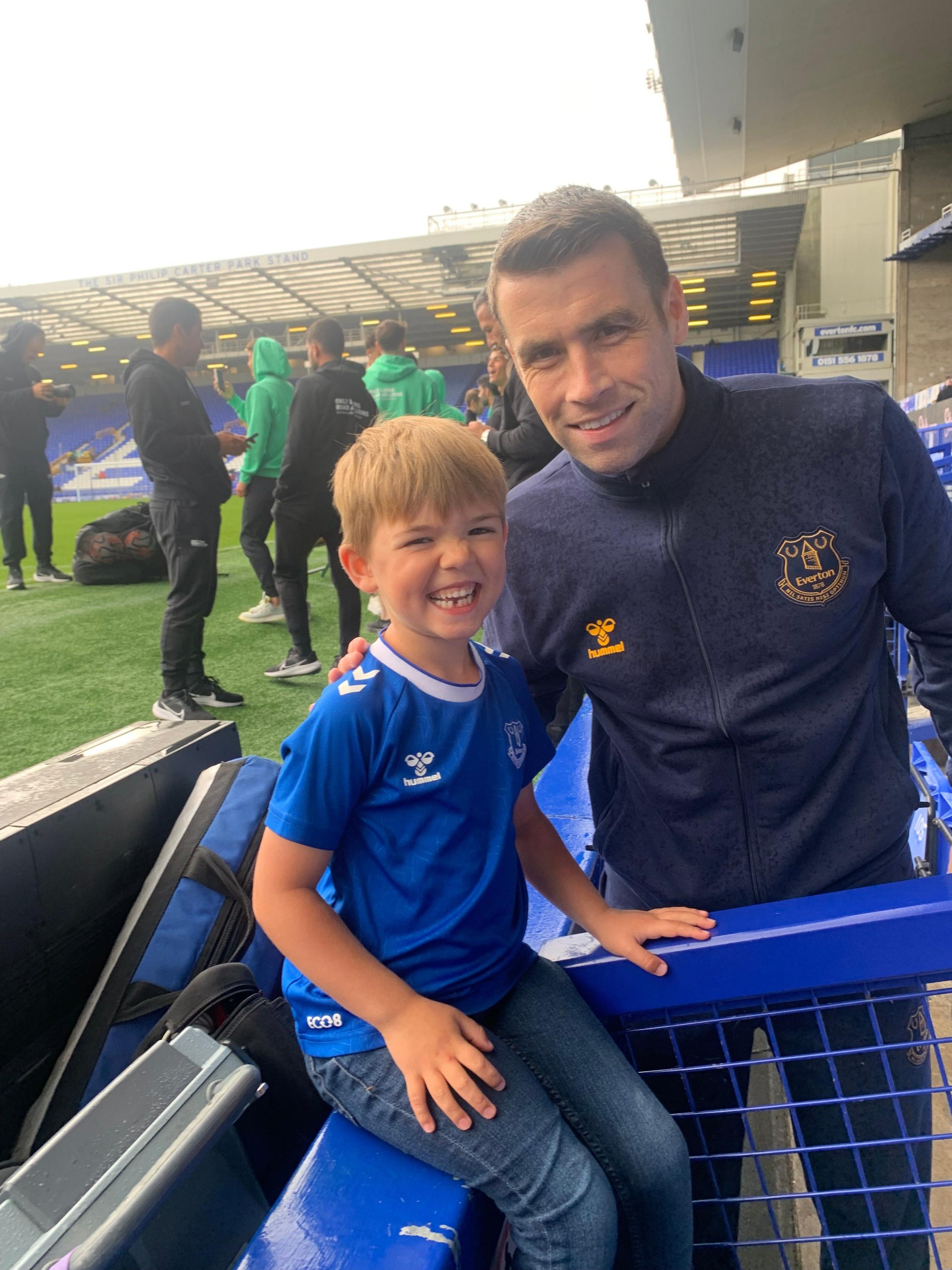 A picture of a small boy in an Everton shirt with Seamus Coleman