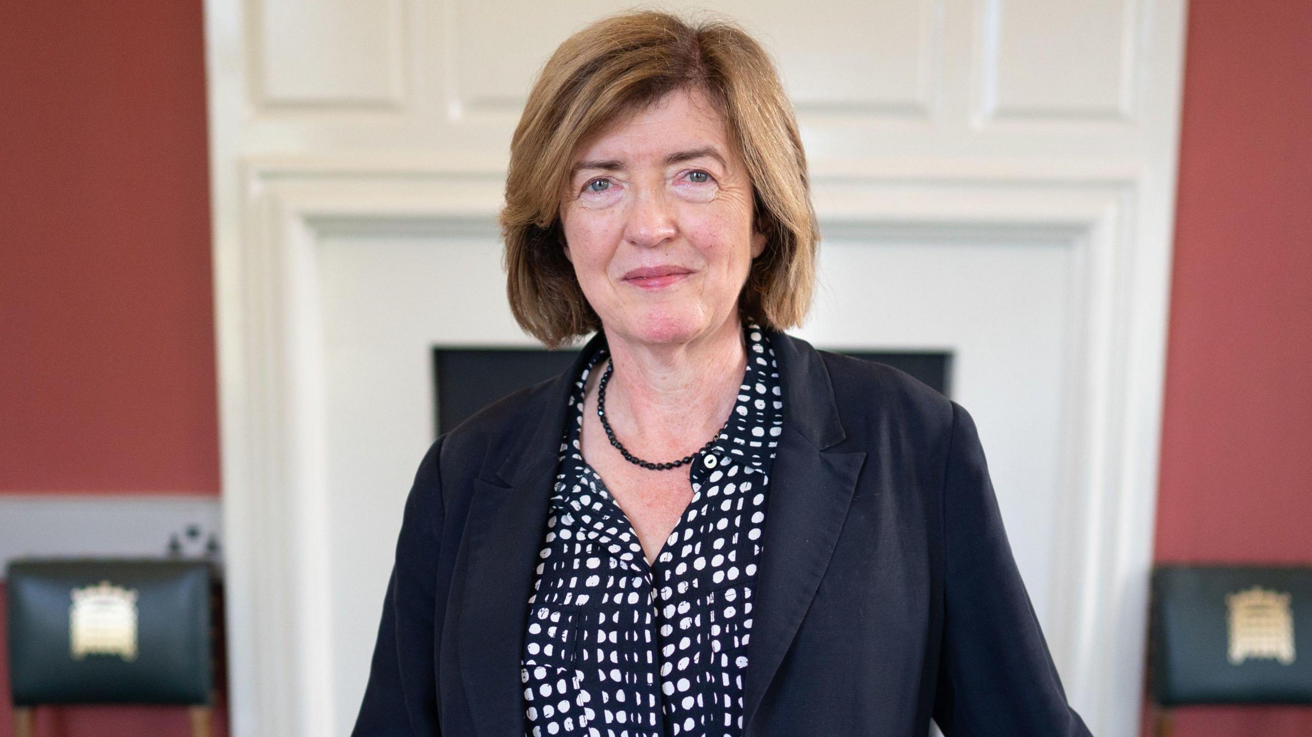 Sue Gray head and shoulders portrait as she smiles looking at the camera wearing a black and white shirt and black jacket with a black necklace, in her office in the Houses of Parliament on her first day as Starmer's chief of staff, taken in London on 4 September