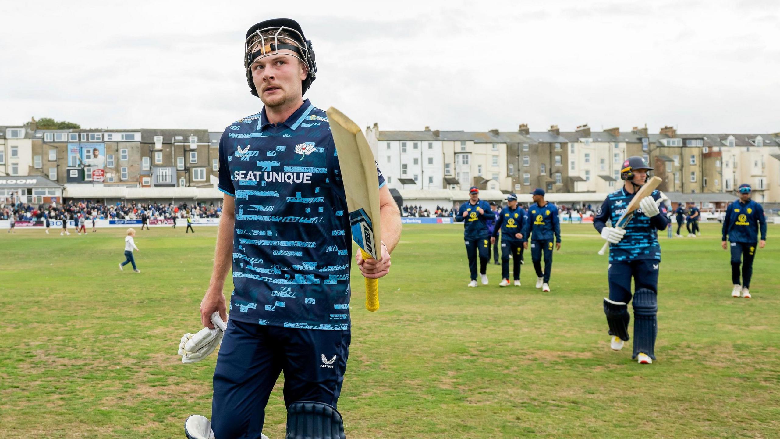 Finlay Bean is applauded off the field after his unbeaten hundred for Yorkshire