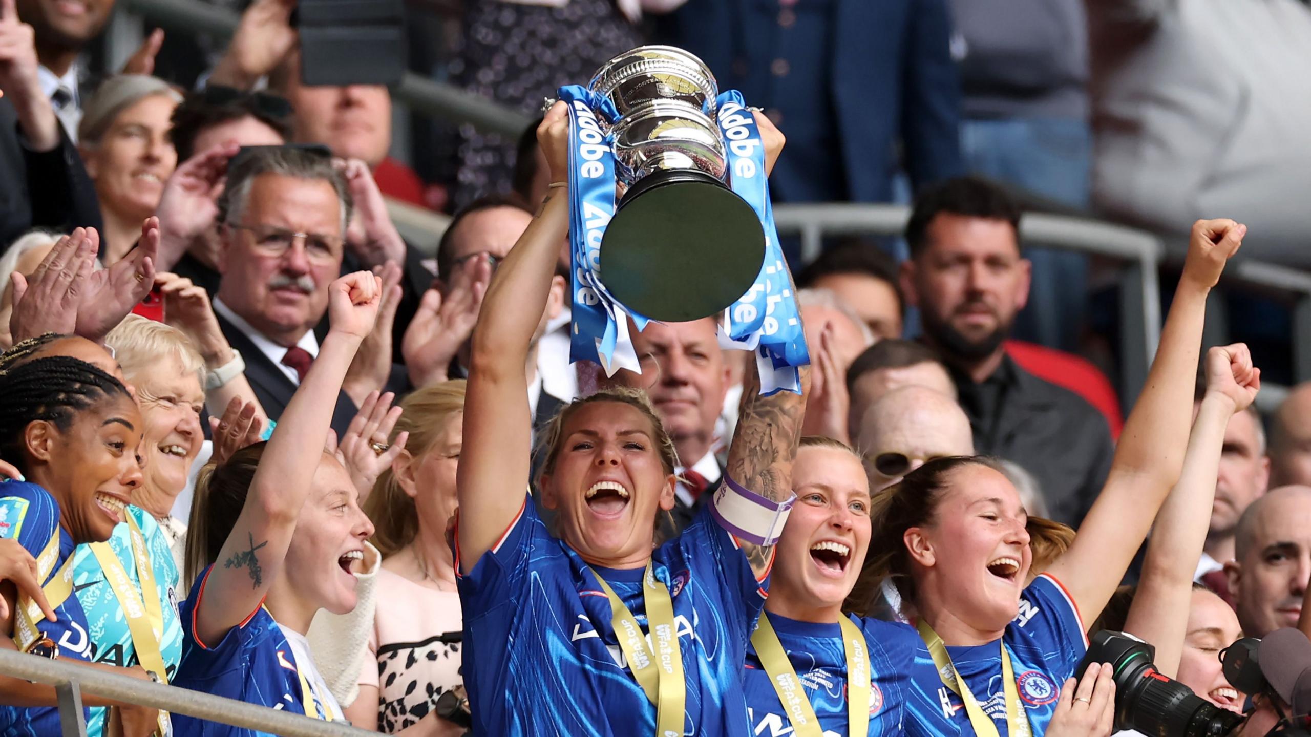 Chelsea players lifting the FA Cup trophy in 2025