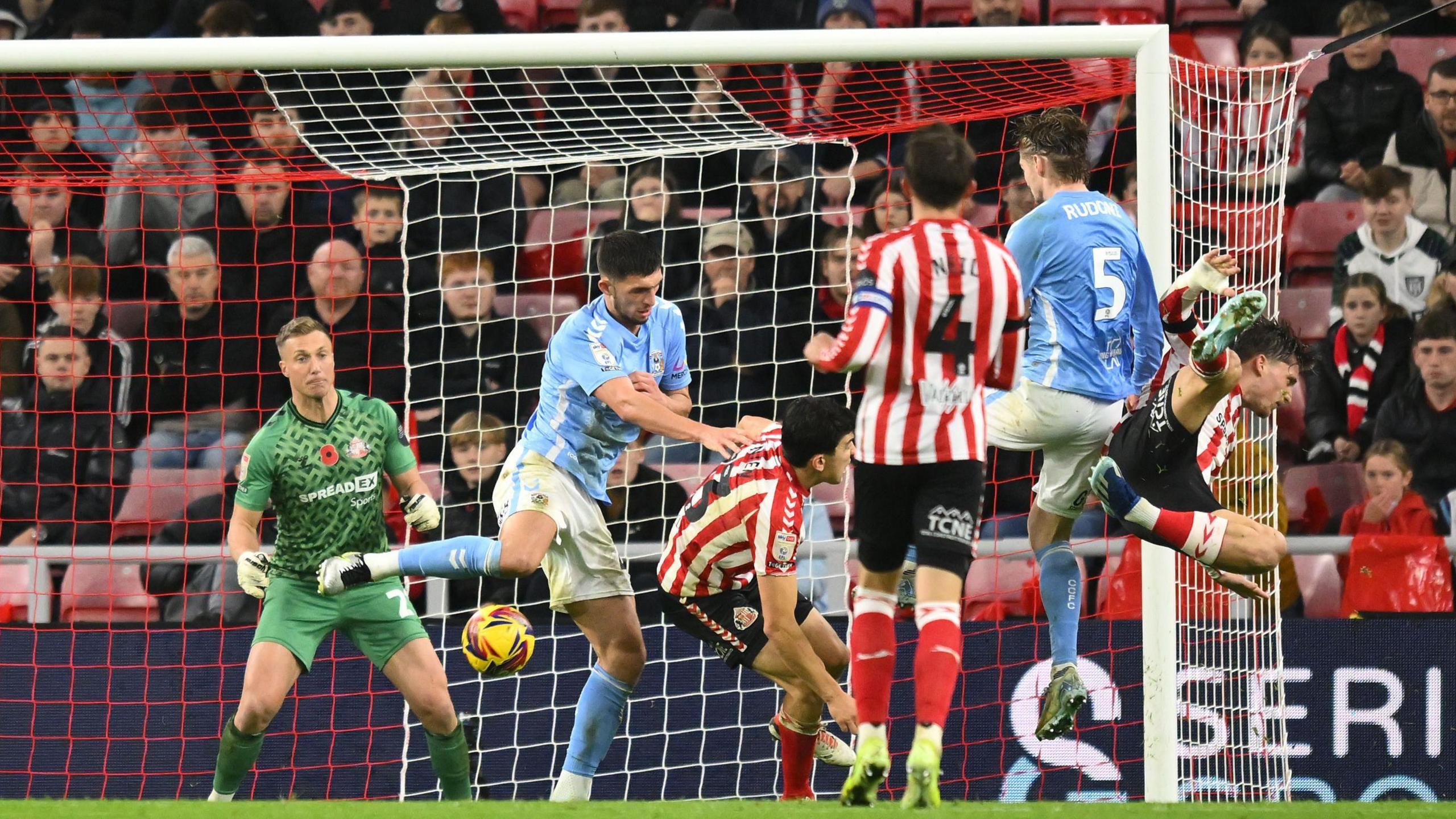 Jack Rudoni gets the better of Sunderland defenders to fire the ball into the net for Coventry against Sunderland