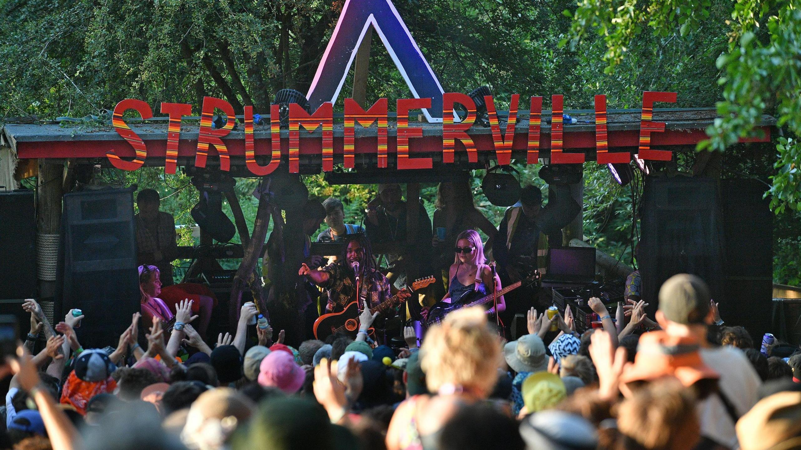 Crowds listening to someone on stage