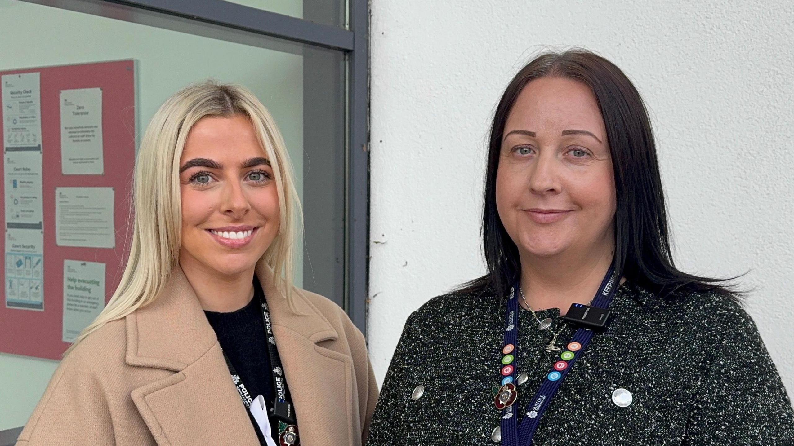 Det Con Georgia Read and Det Con Sophie Moore standing next to each other outside Ipswich Crown Court. They are both smiling and looking directly into the camera.