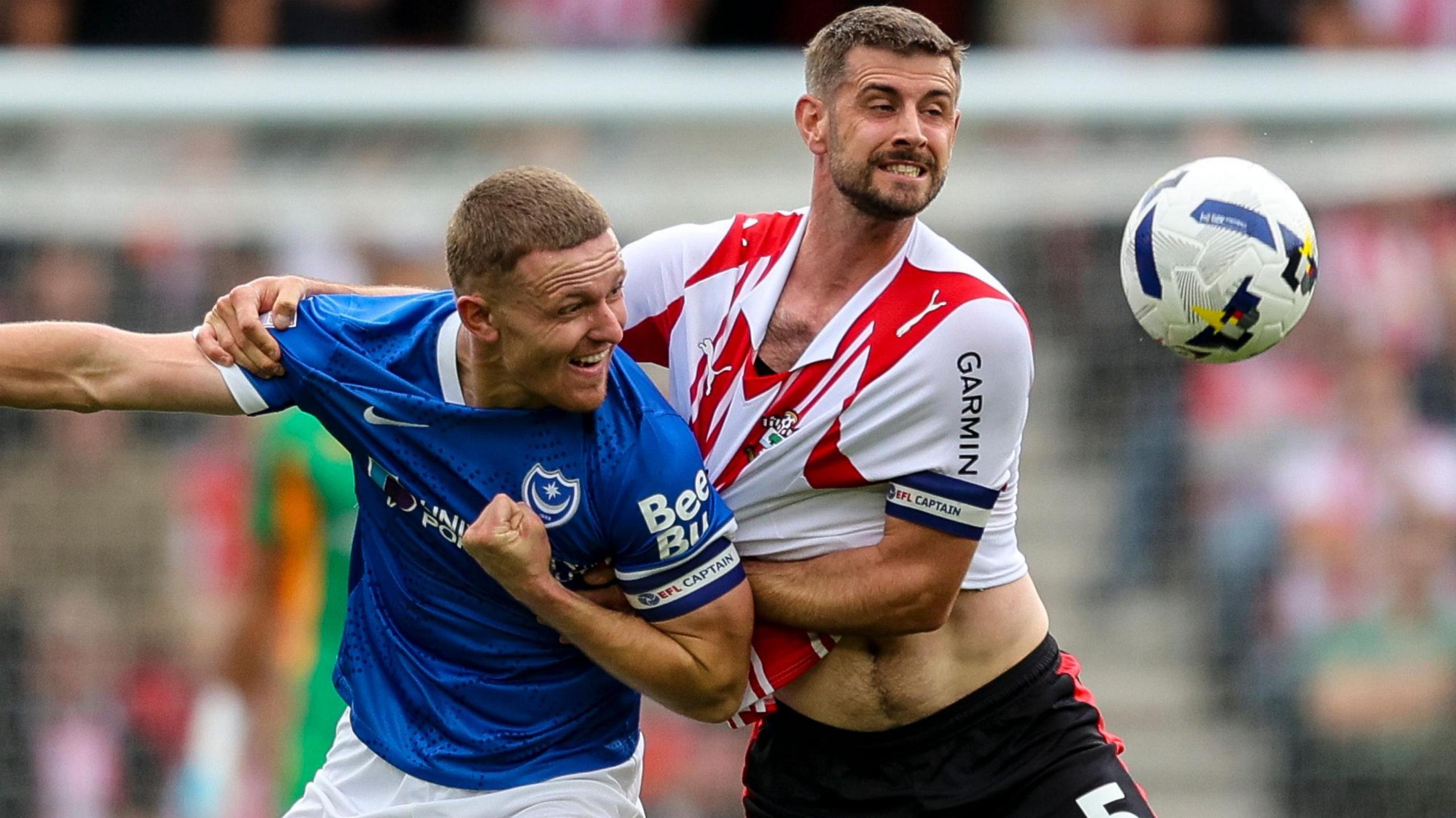 Portsmouth's Colby Bishop grapples with Southampton's Jack Stephens