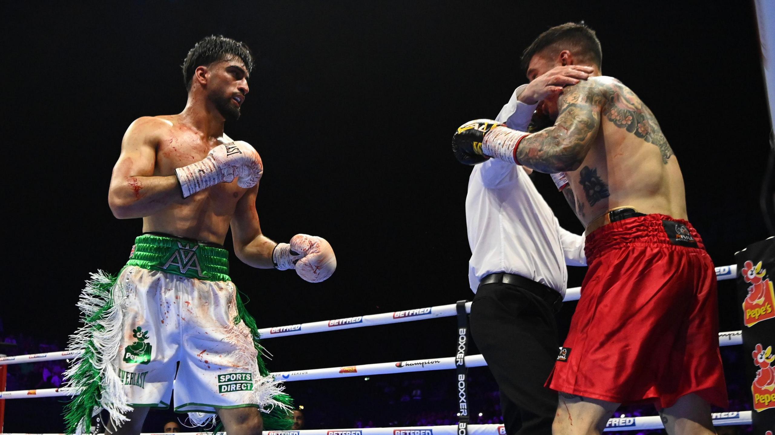 Referee stops the fight between Adam Azim and Steve Claggett
