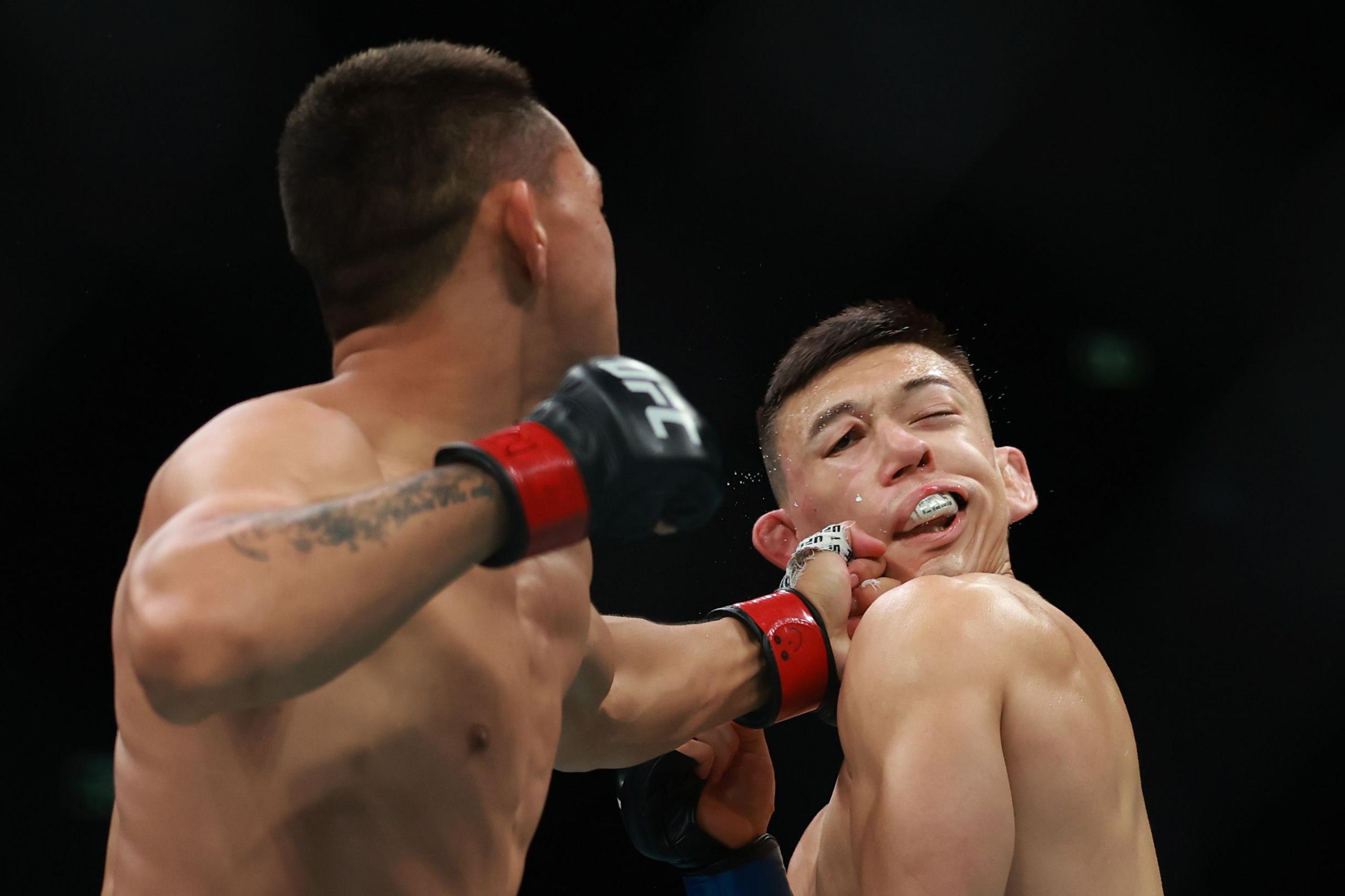 Rongzhu of China fights Kody Steel of United States of America in their Lightweight Bout during UFC 312 at Qudos Bank Arena in Sydney, Australia