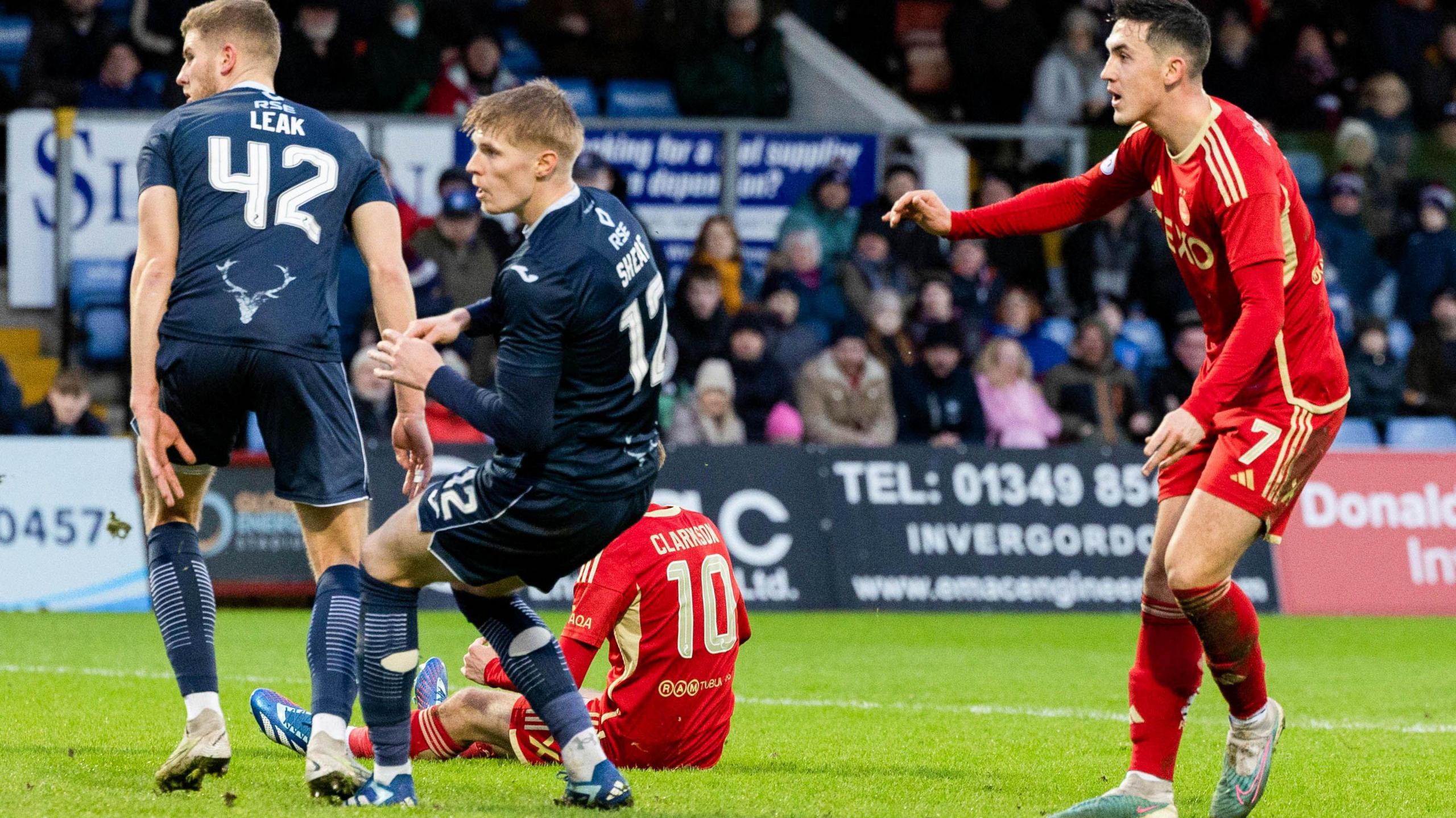 Aberdeen's Jamie McGrath (right) scores against Ross County