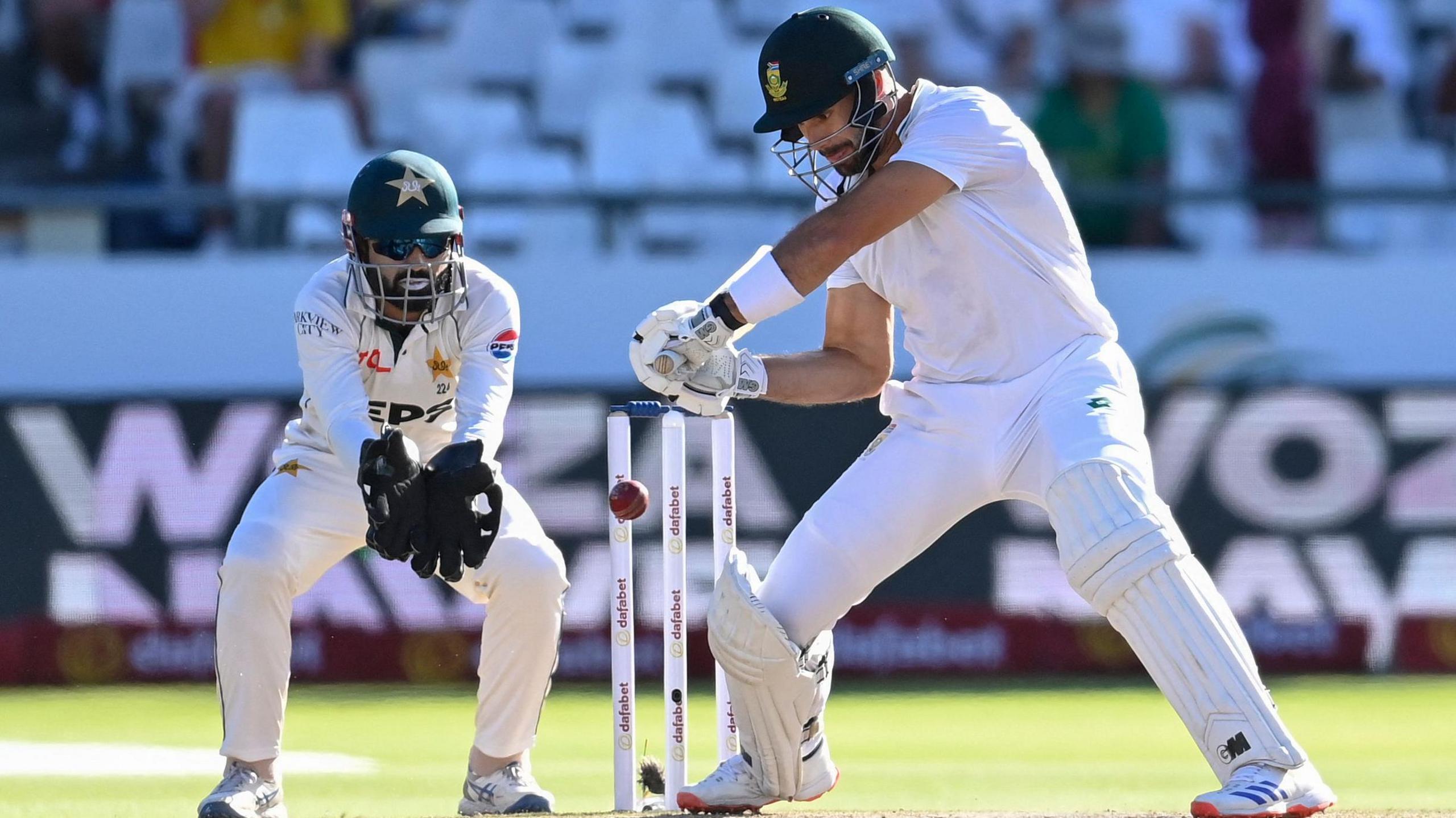 Pakistan wicketkeeper Mohammad Rizwan and South Africa batter Aiden Markram during a Test in Cape Town in January 2025