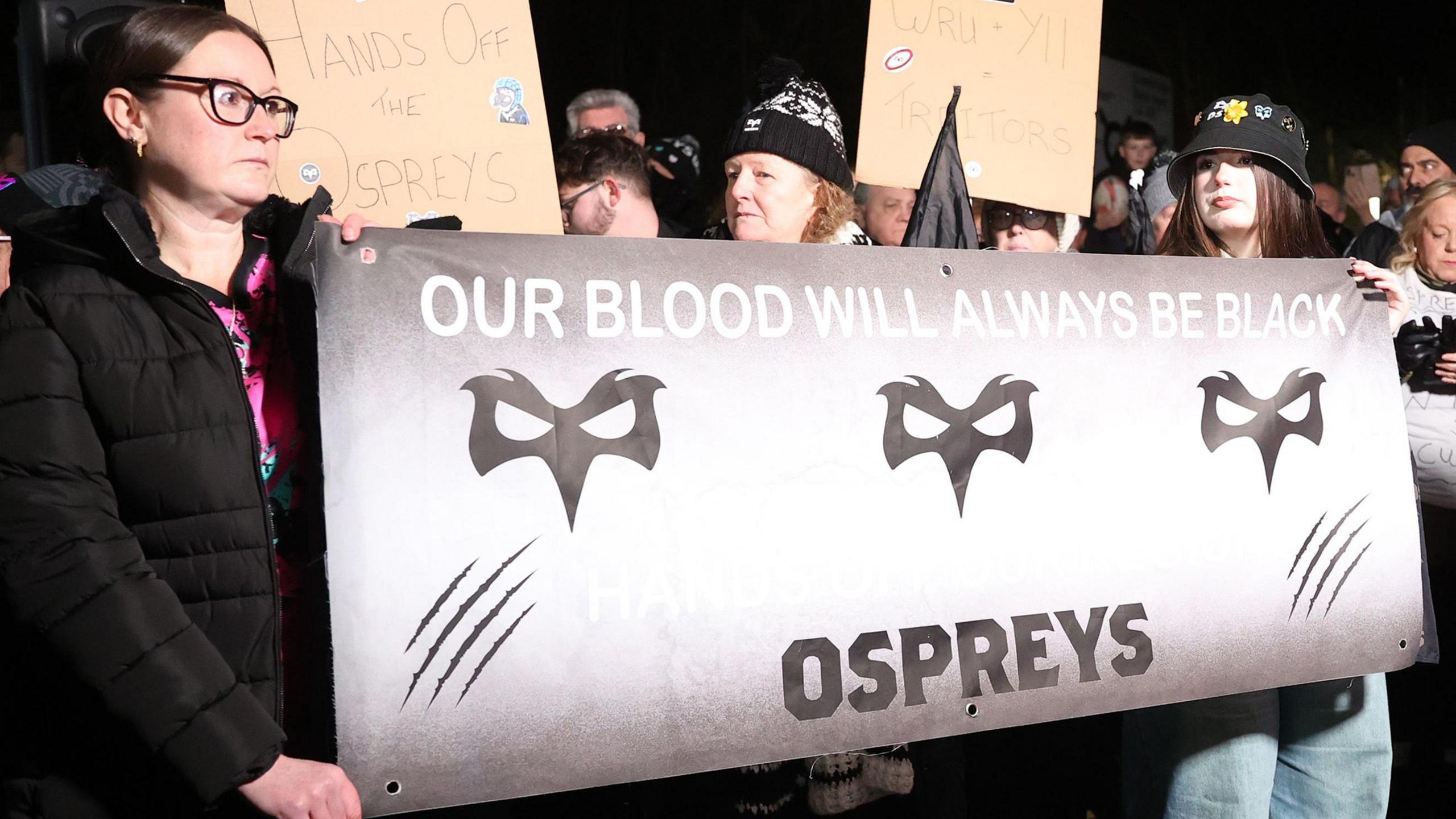 Ospreys fans have protested against the proposed bid by their owners to buy Cardiff from the Welsh Rugby Union (WRU)