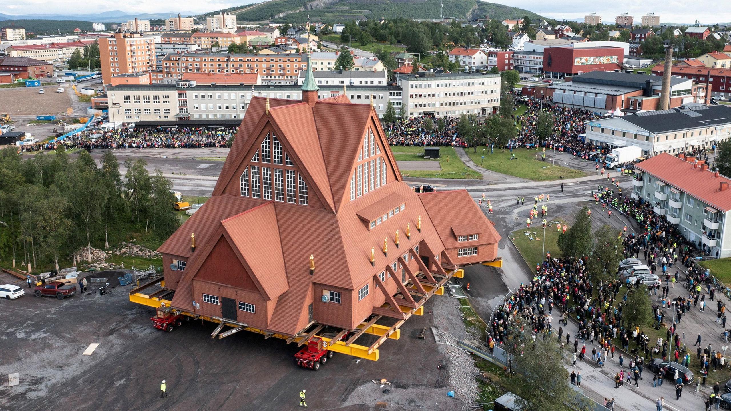 On a specially designed trolley with 224 wheels, Kiruna Church, is moved at a speed of half a kilometer per hour, during a relocation due to the expansion of an iron ore mine, in Kiruna, Sweden, August 19, 2025 in this drone view. 
