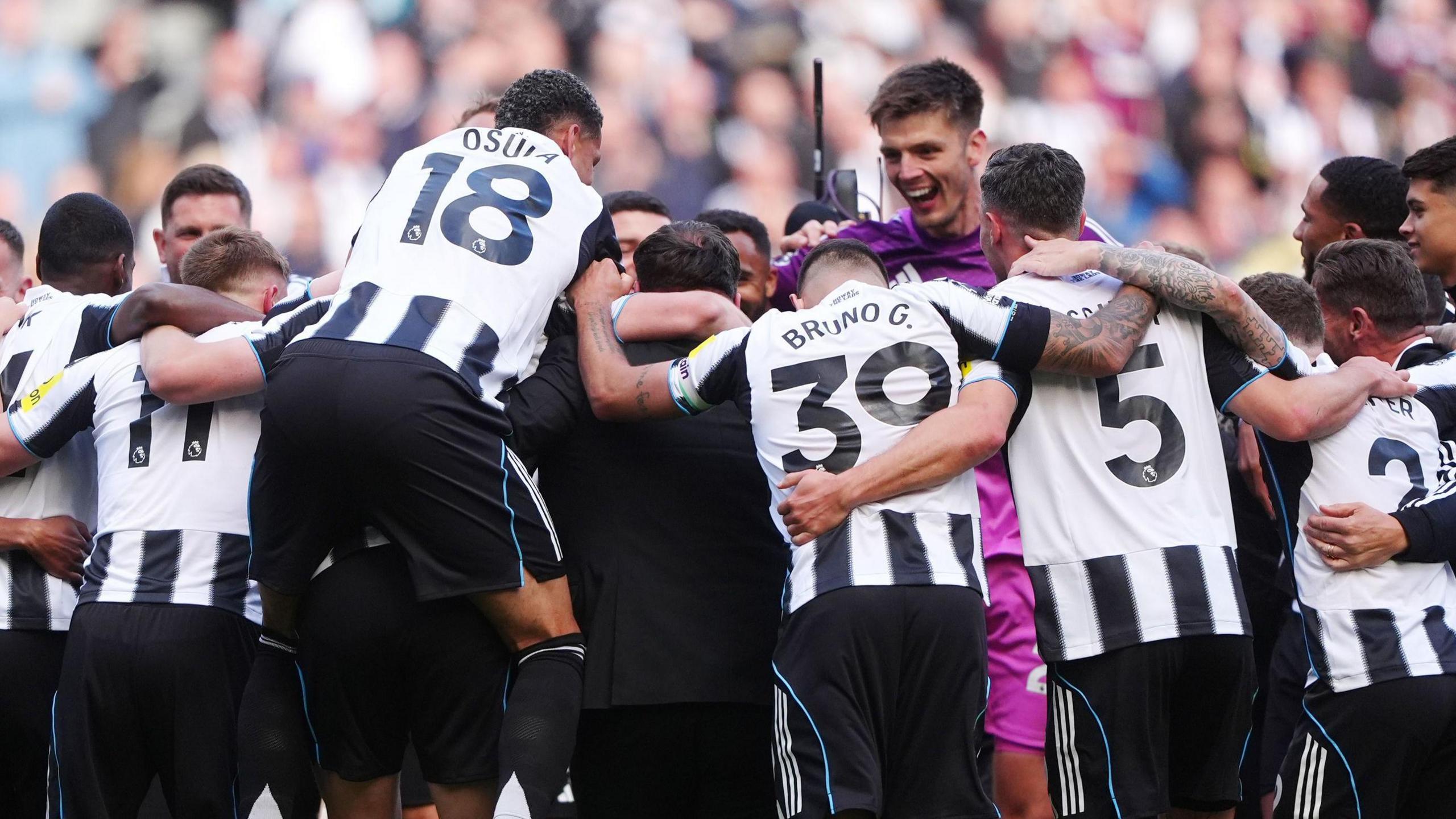 Newcastle United players celebrate after reaching the Champions League despite defeat at home to Everton on the season's final day