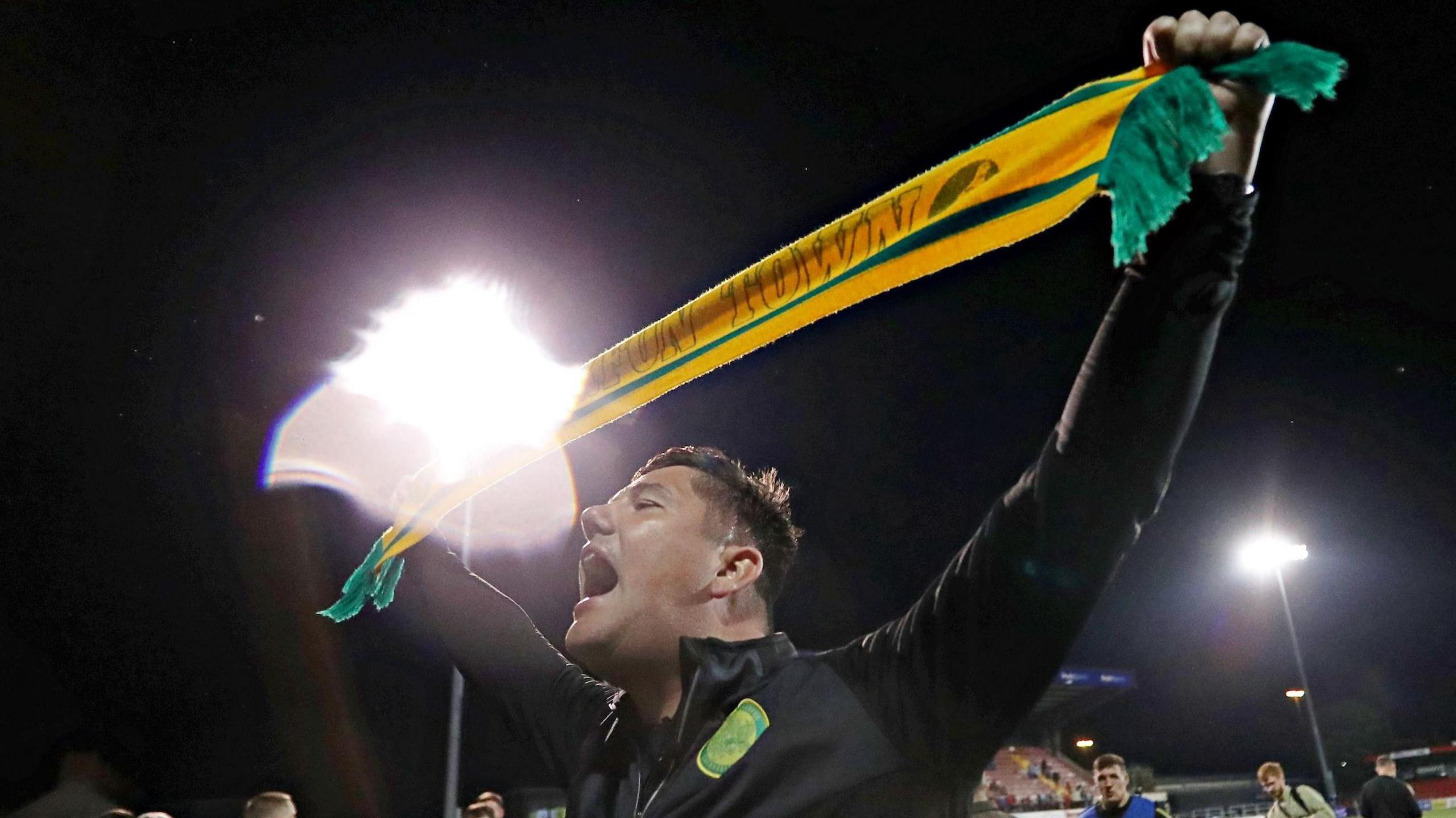 Caernarfon Town manager Richard Davies celebrates following the win over Crusaders on penalties in the first qualifying round