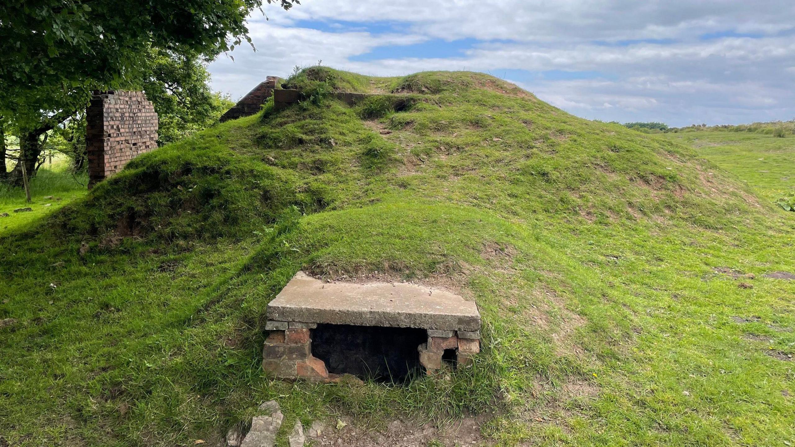 A hole in the bunker where power cables came out of