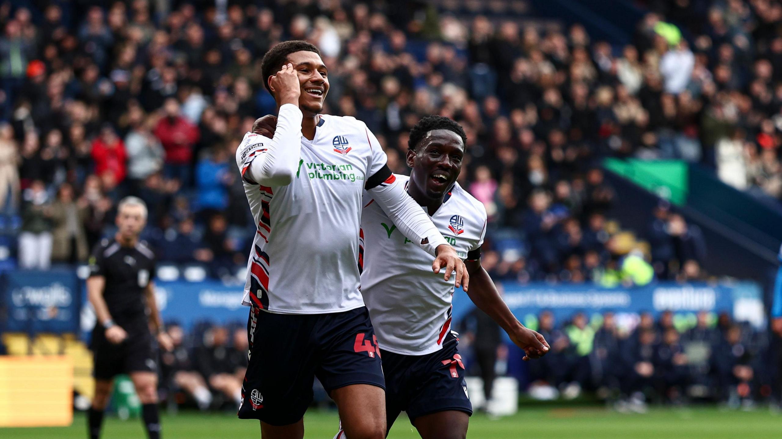 Mason Burstow celebrates a goal for Bolton
