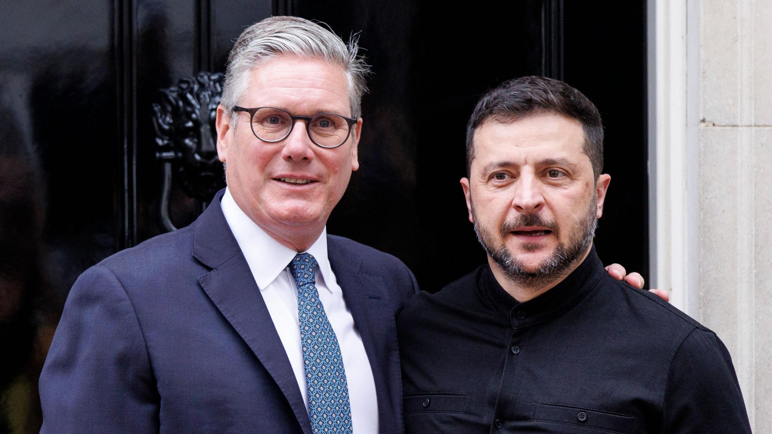 British Prime Minister Keir Starmer (L) and Ukrainian President Volodymyr Zelensky pose for a photo at 10 Downing Street in London