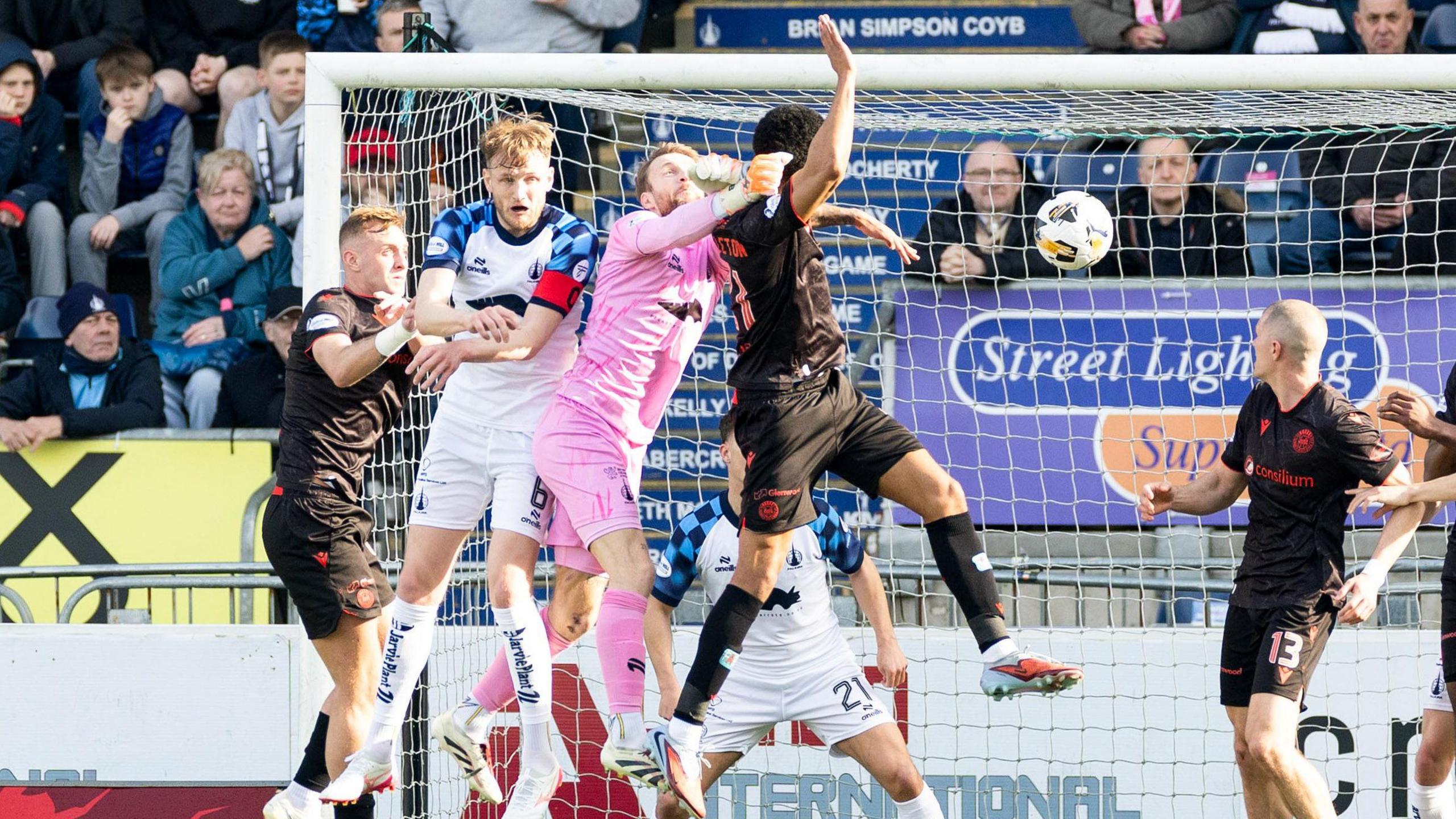 Miguel Freckleton crashes in a header