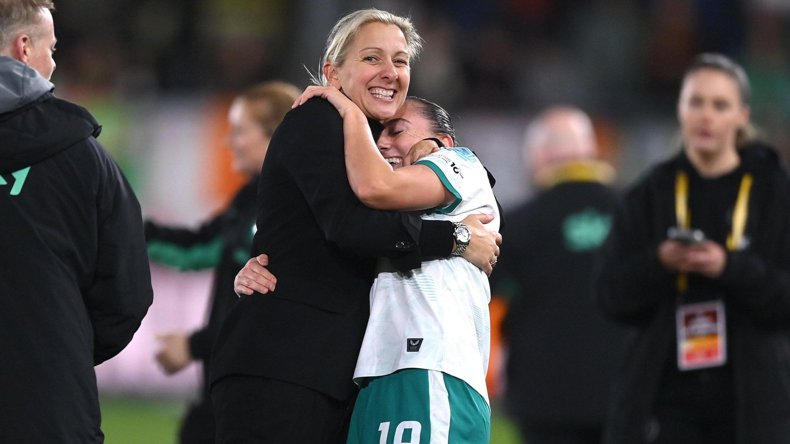 Carla Ward celebrates with Abbie Larkin at the end of the game
