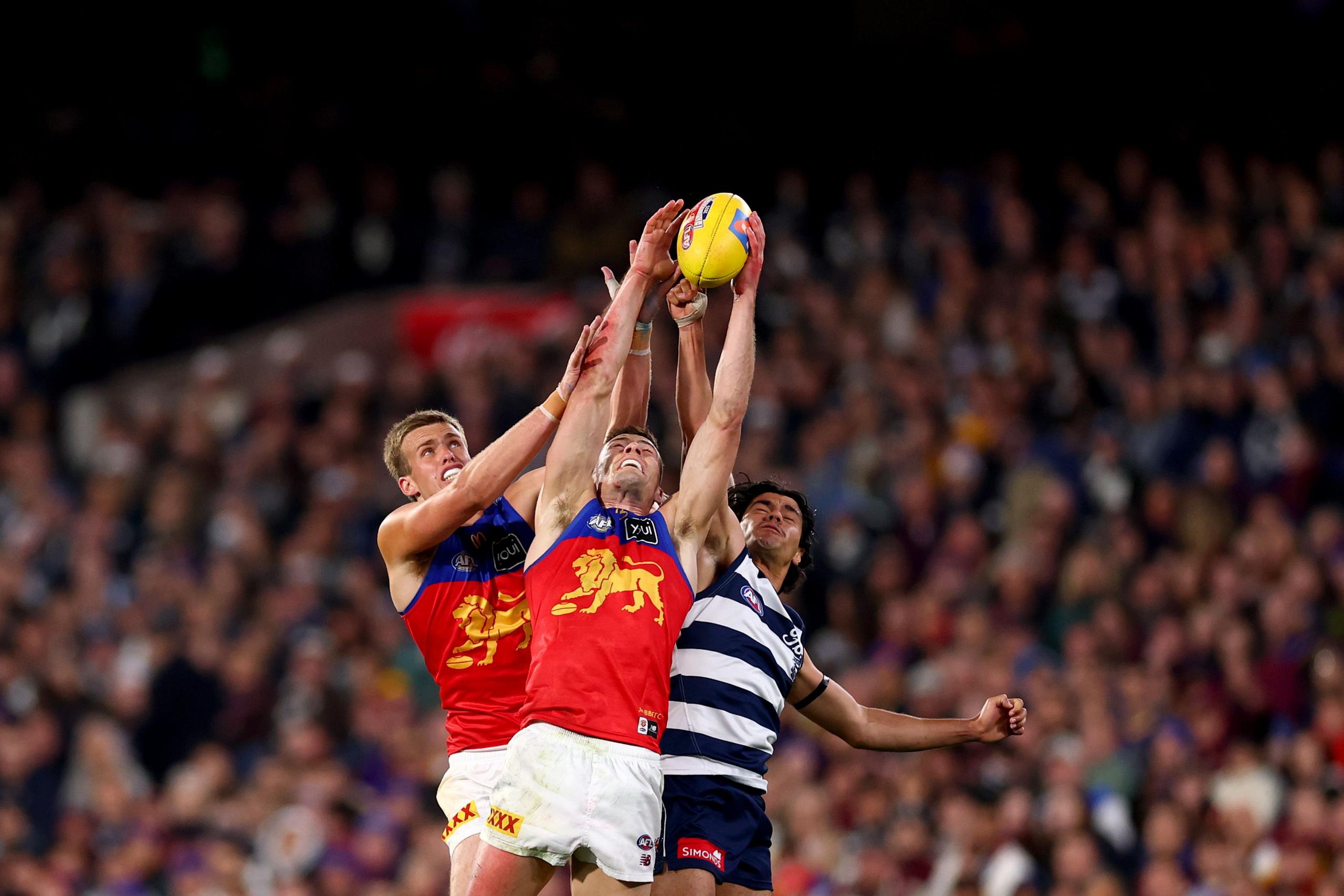 The Lions' Ty Gallop and Josh Dunkley alongside the Cat's Lawson Humphries compete for a mark during the AFL Qualifying Final match between Geelong Cats and Brisbane Lions at Melbourne Cricket Ground in Australia. Photo by Daniel Pockett