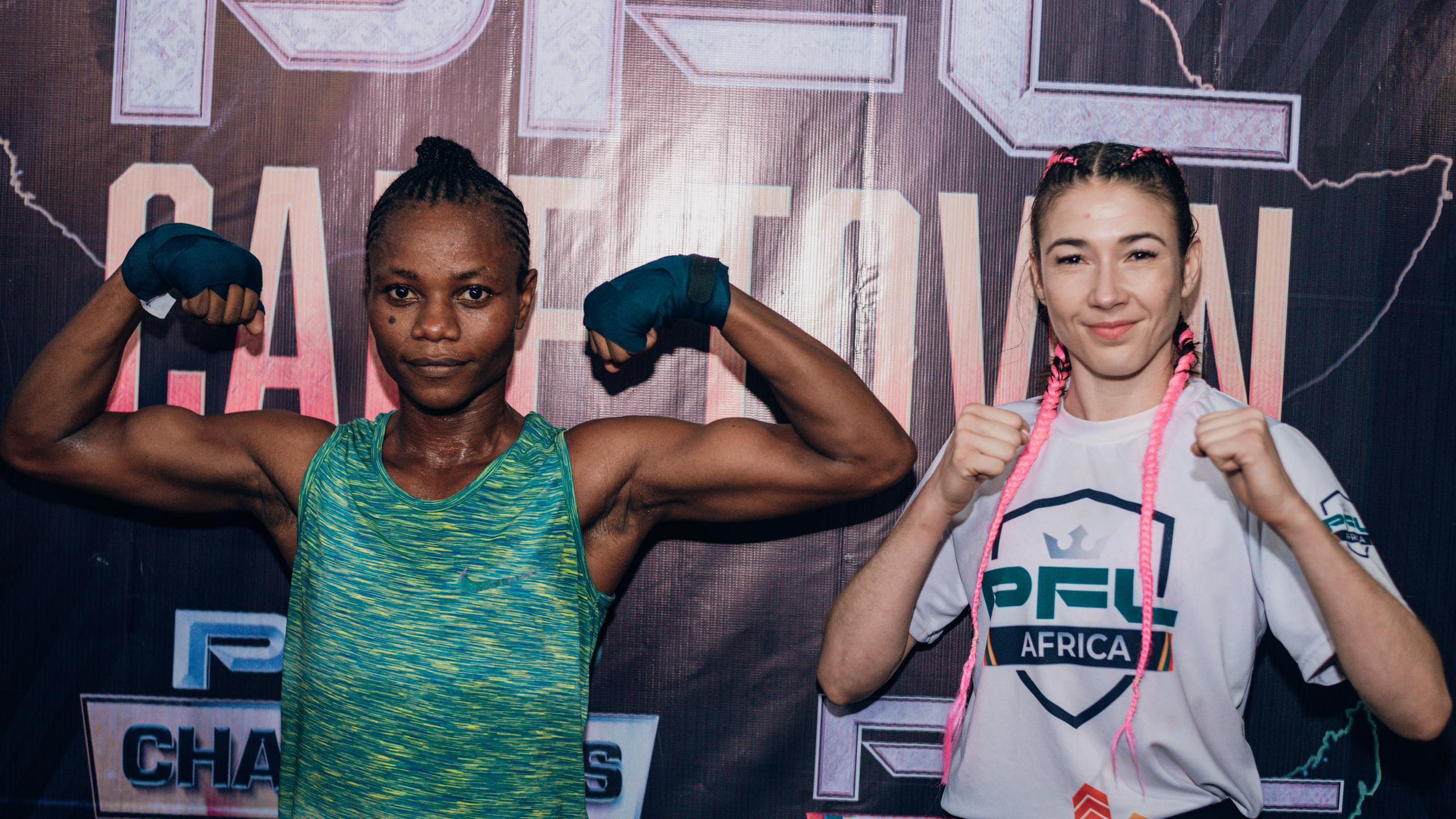 Juliet Ukah (left) wears a green and yellow training kit with both arms raised to show her strength during a workout and face-off session against South Africa's Ceileigh Niedermayr in DR Congo