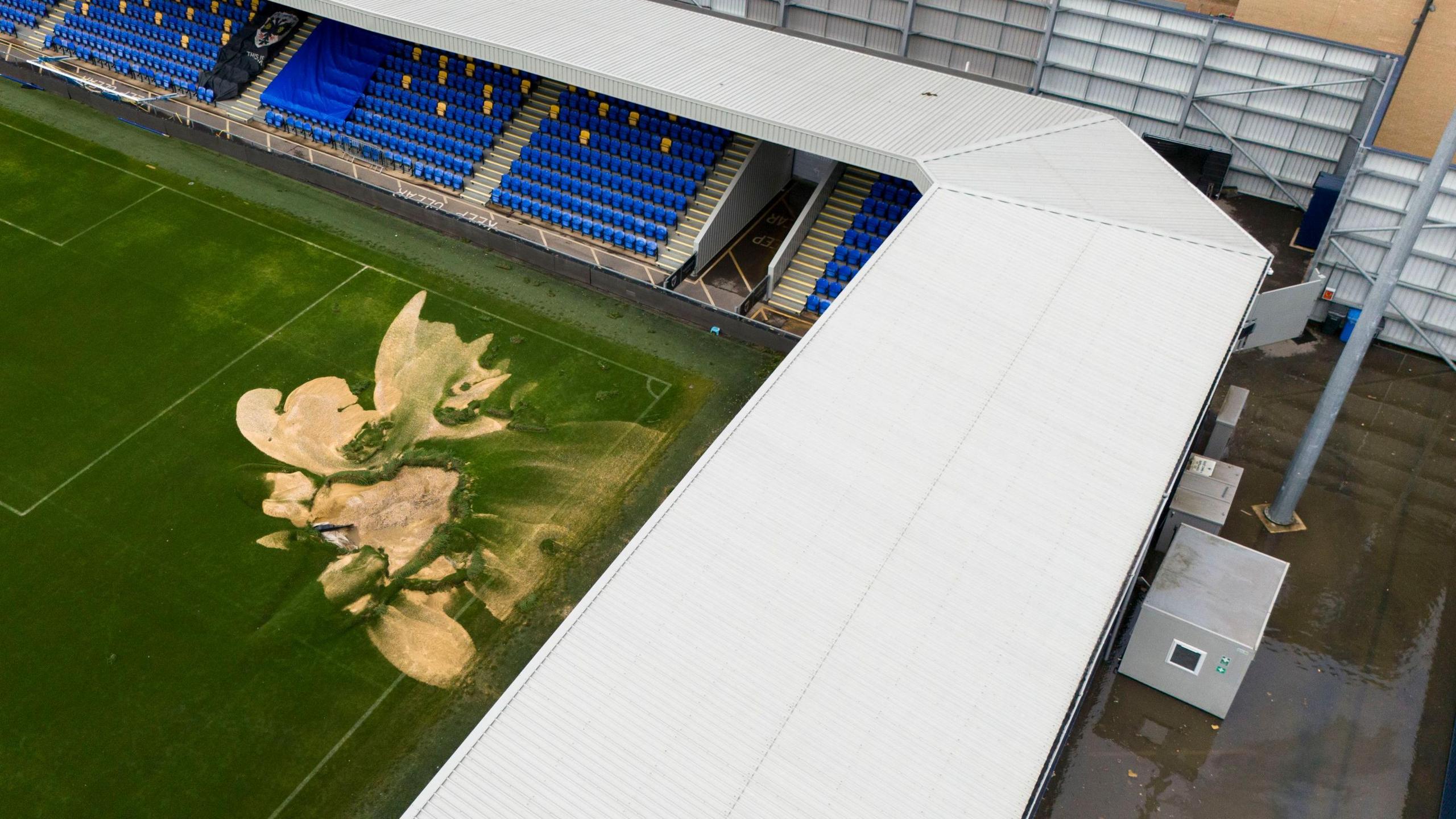 The pitch at the Cherry Red Records Stadium was damaged by flood water, while the concourses and club buildings were flooded