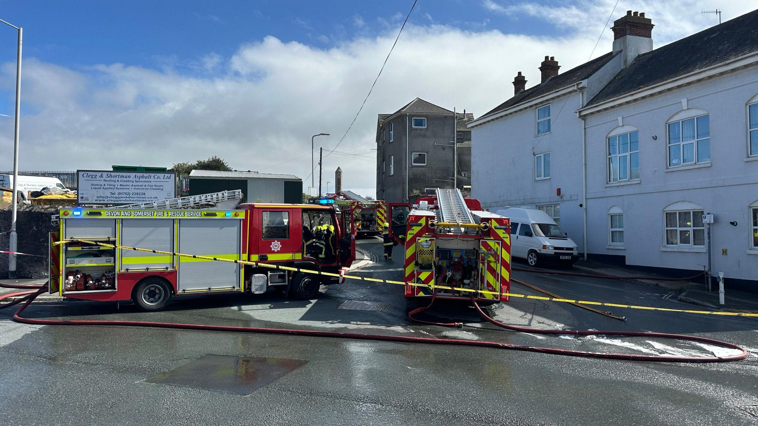 Fire engines are seen behind yellow tape at the scene of the fire at Breakwater Breakers in Plymouth