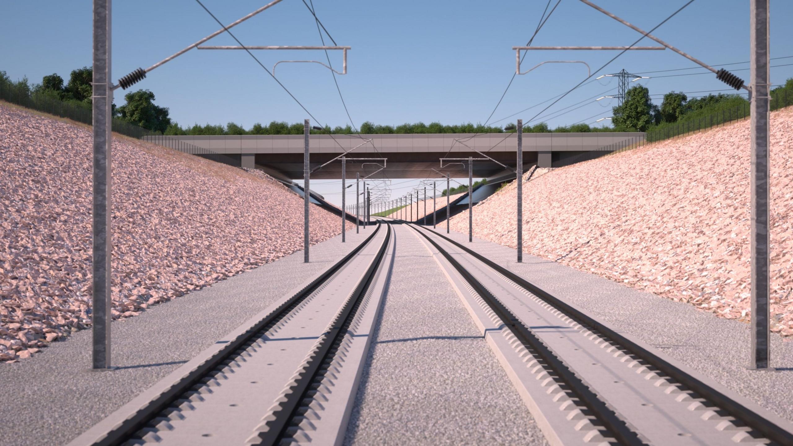 A computer-generated image shows train tracks in a gravel trench. Overhead cables and pylons can be seen. A bridge, featuring trees and plants, can be seen over the track.