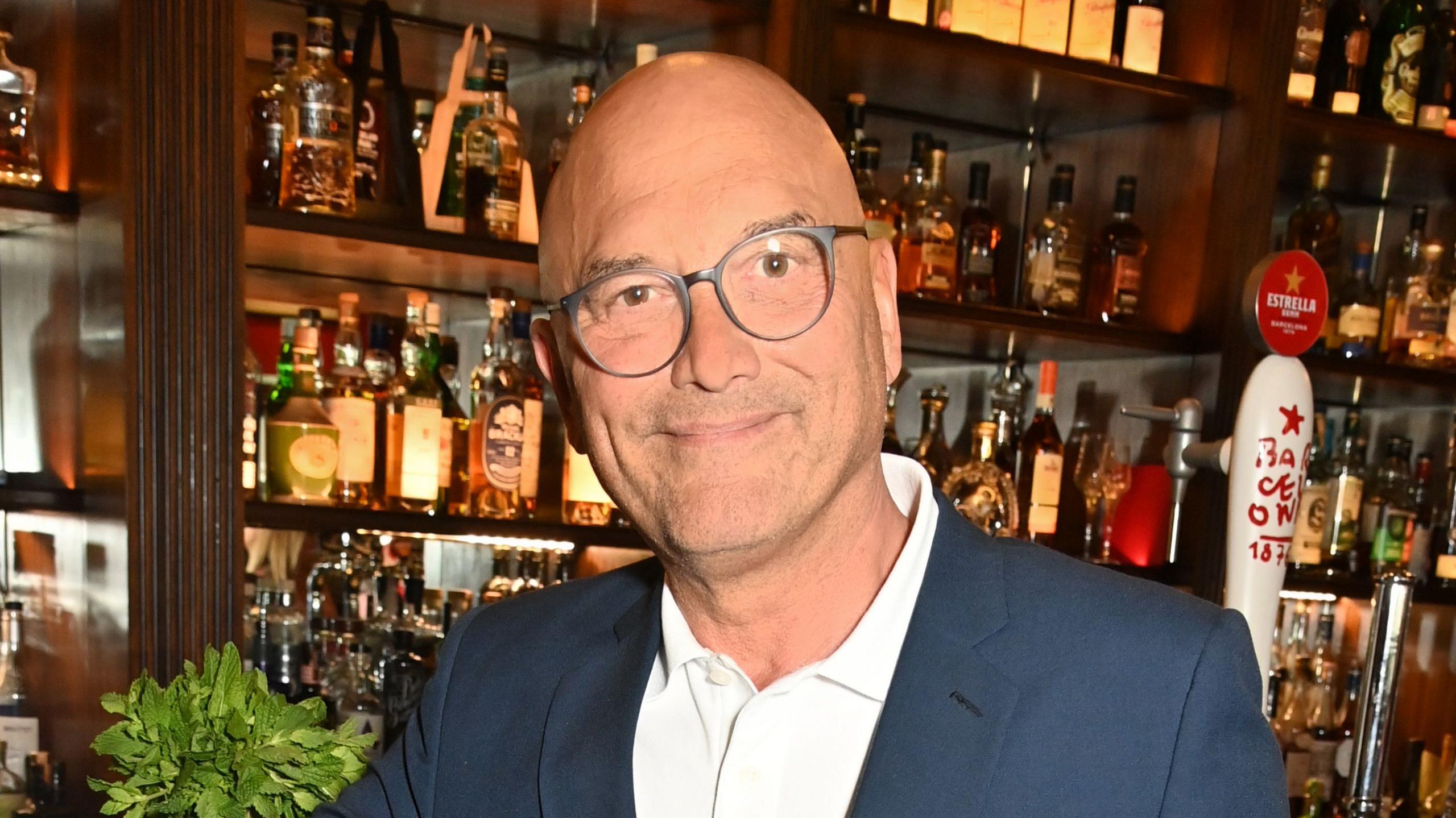 A picture of MasterChef host Gregg Wallace in a white shirt and navy suit jacket