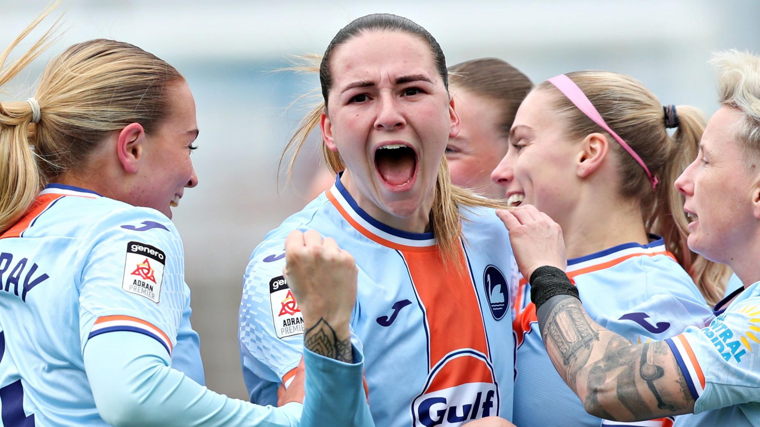 Swansea celebrate scoring against Wrexham in the Adran Premier