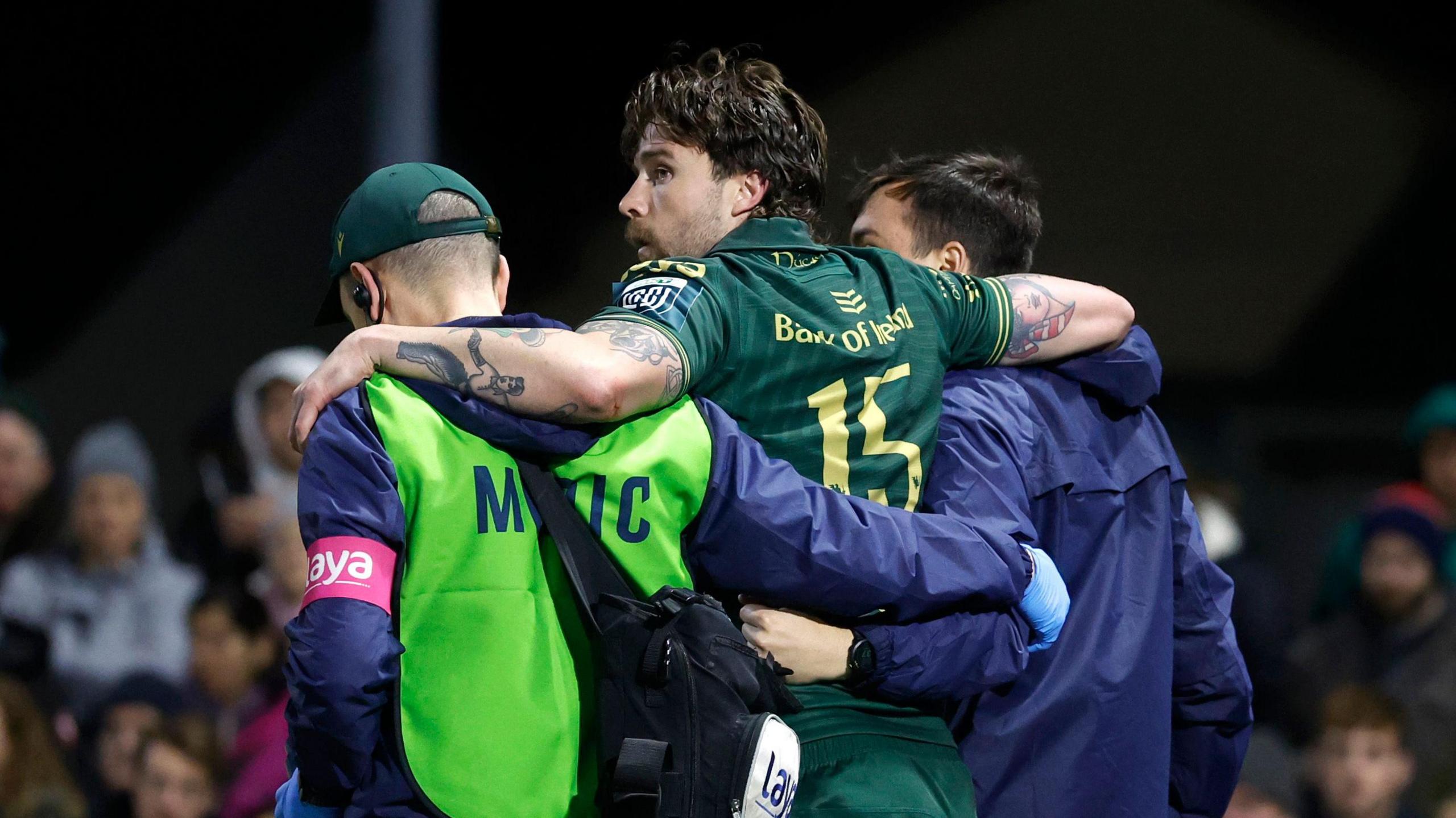 Mack Hansen is carried from the field