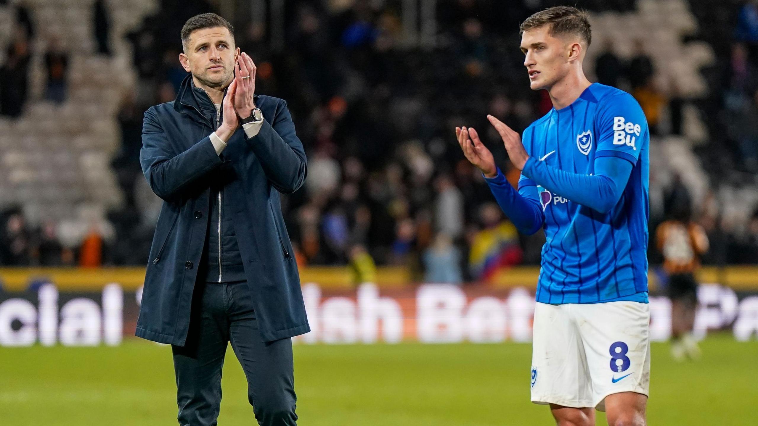 Portsmouth head coach John Mousinho with on-loan West Ham midfielder Freddie Potts