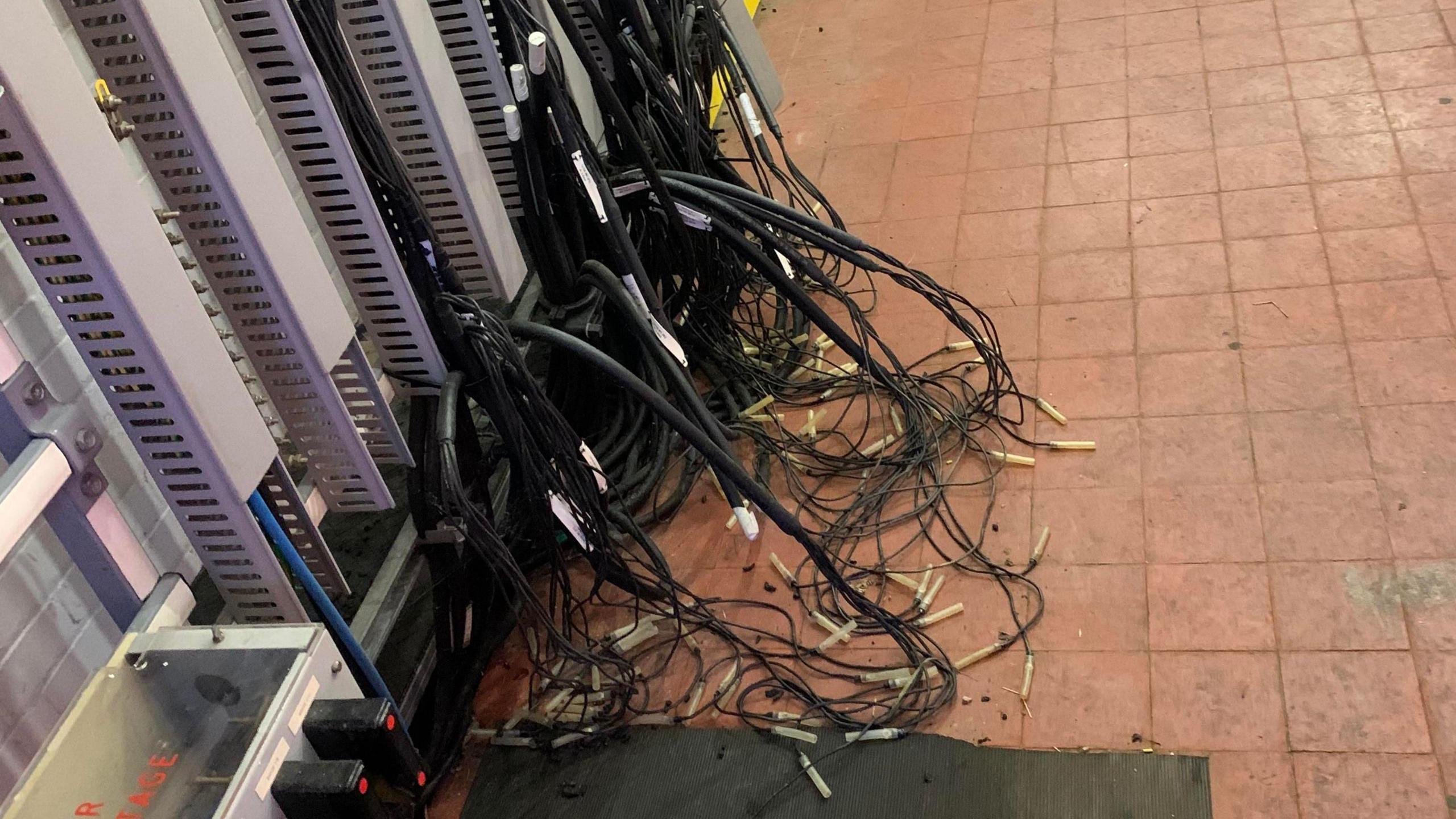  Signalling equipment at Northampton. The wires look to have been pulled away from the wall and are on the floor or the same building the engineers were in in the above image. 