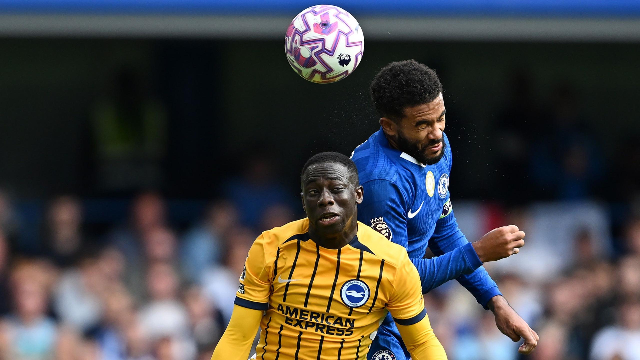 Yankuba Minteh of Brighton contends for the aerial ball with Reece James of Chelsea