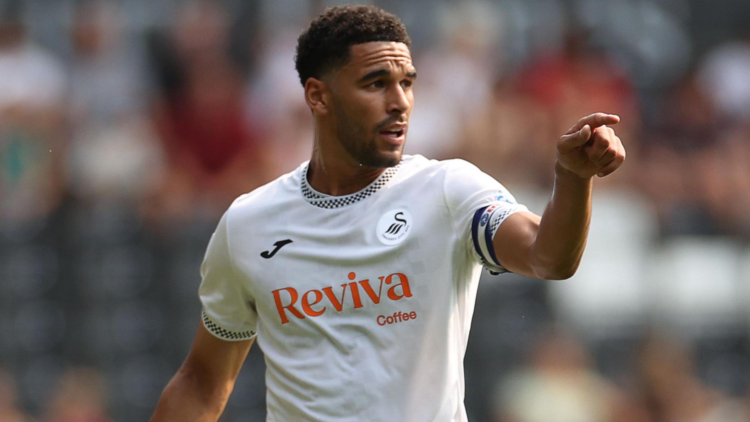 Swansea City skipper Ben Cabango gives retired instructions