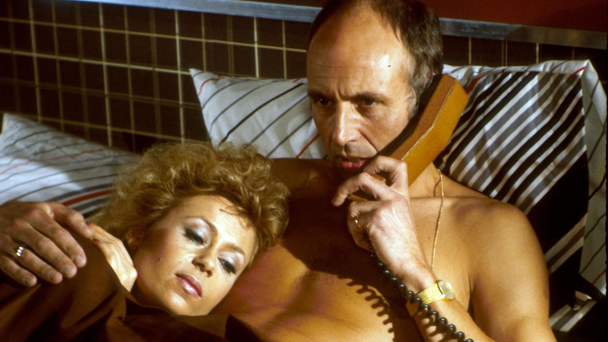 Actress Sally Farmiloe as Dawn and Stephen Yardley as Ken Masters pictured in bed in the nautical soap, Howards Way