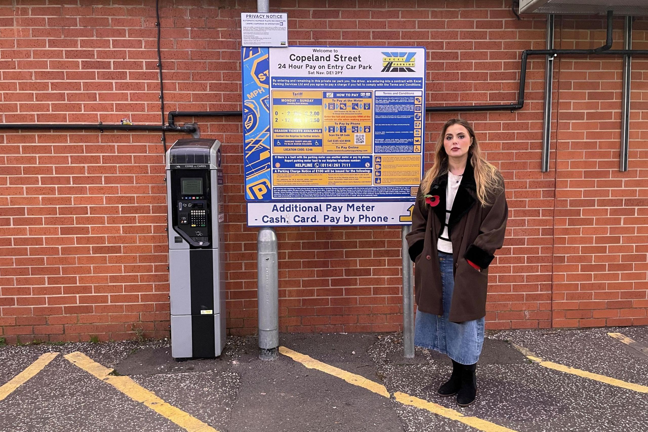 Rosey Hudson next to the payment machine