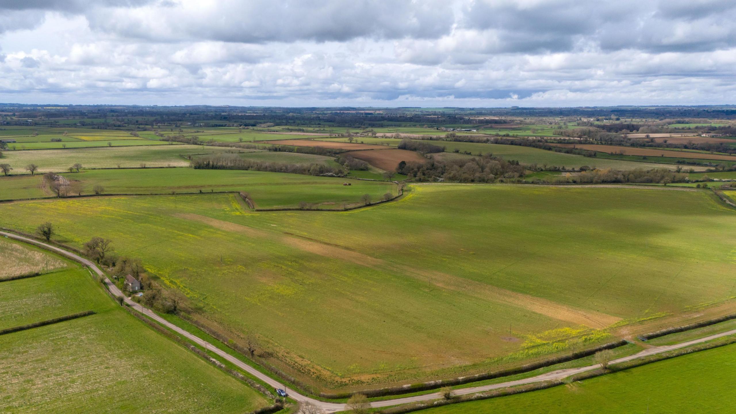 A vast shot of fields in the countryside