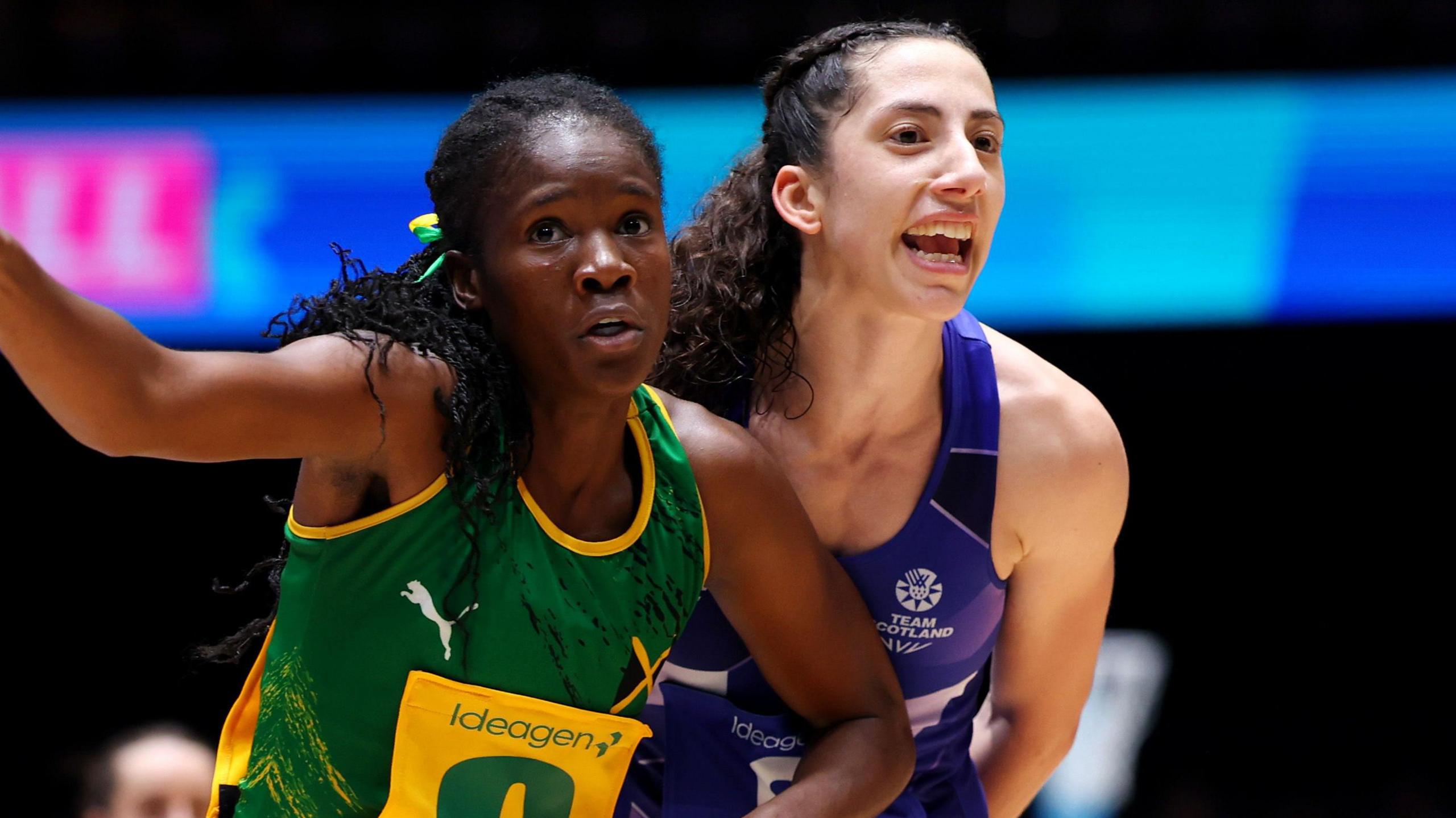 Nicole Dixon-Rochester of Jamaica gestures while under pressure from Hannah Leighton of Scotland during a pool match at the Commonwealth Games 