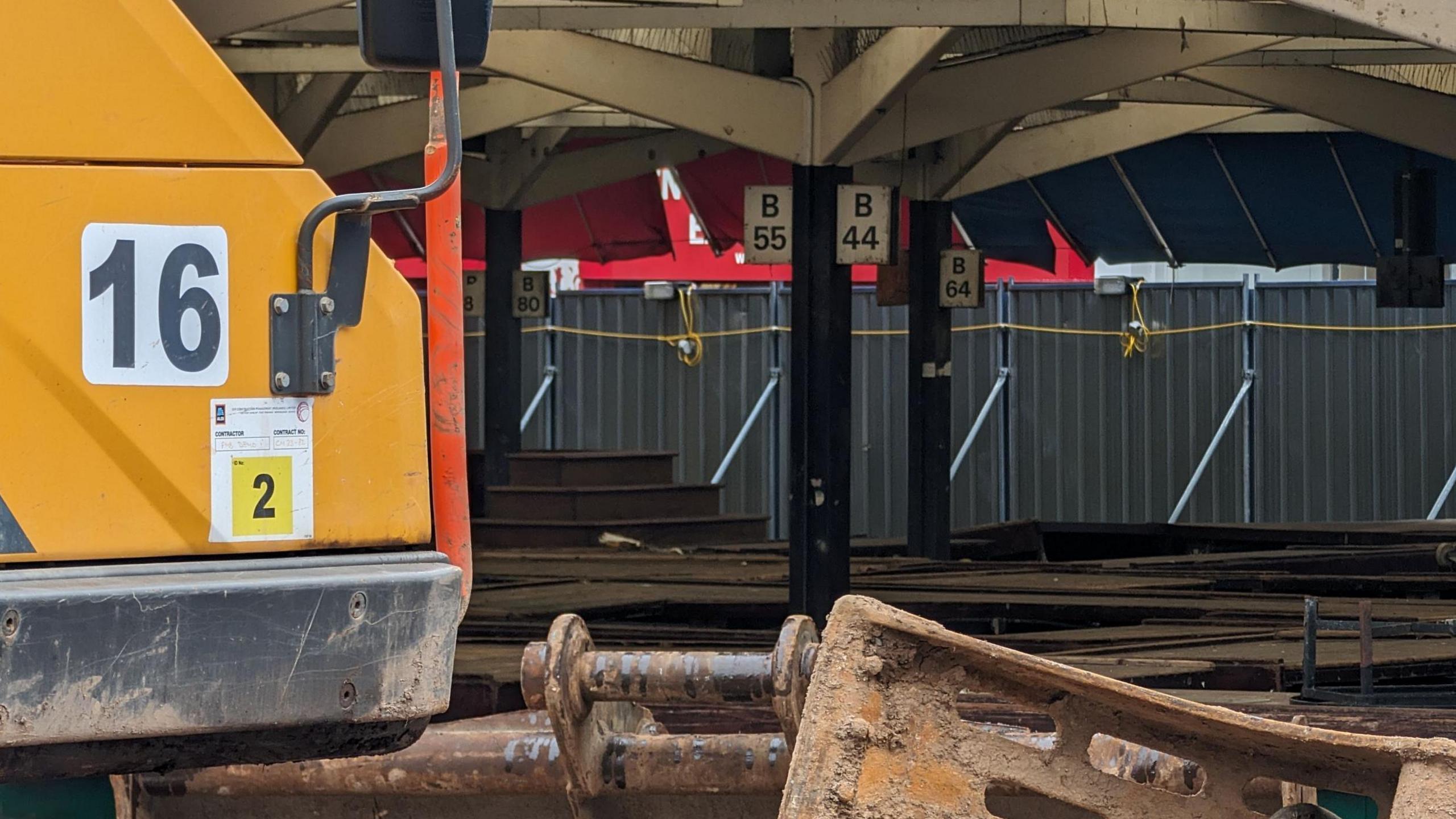 A demolition vehicle inside the old market