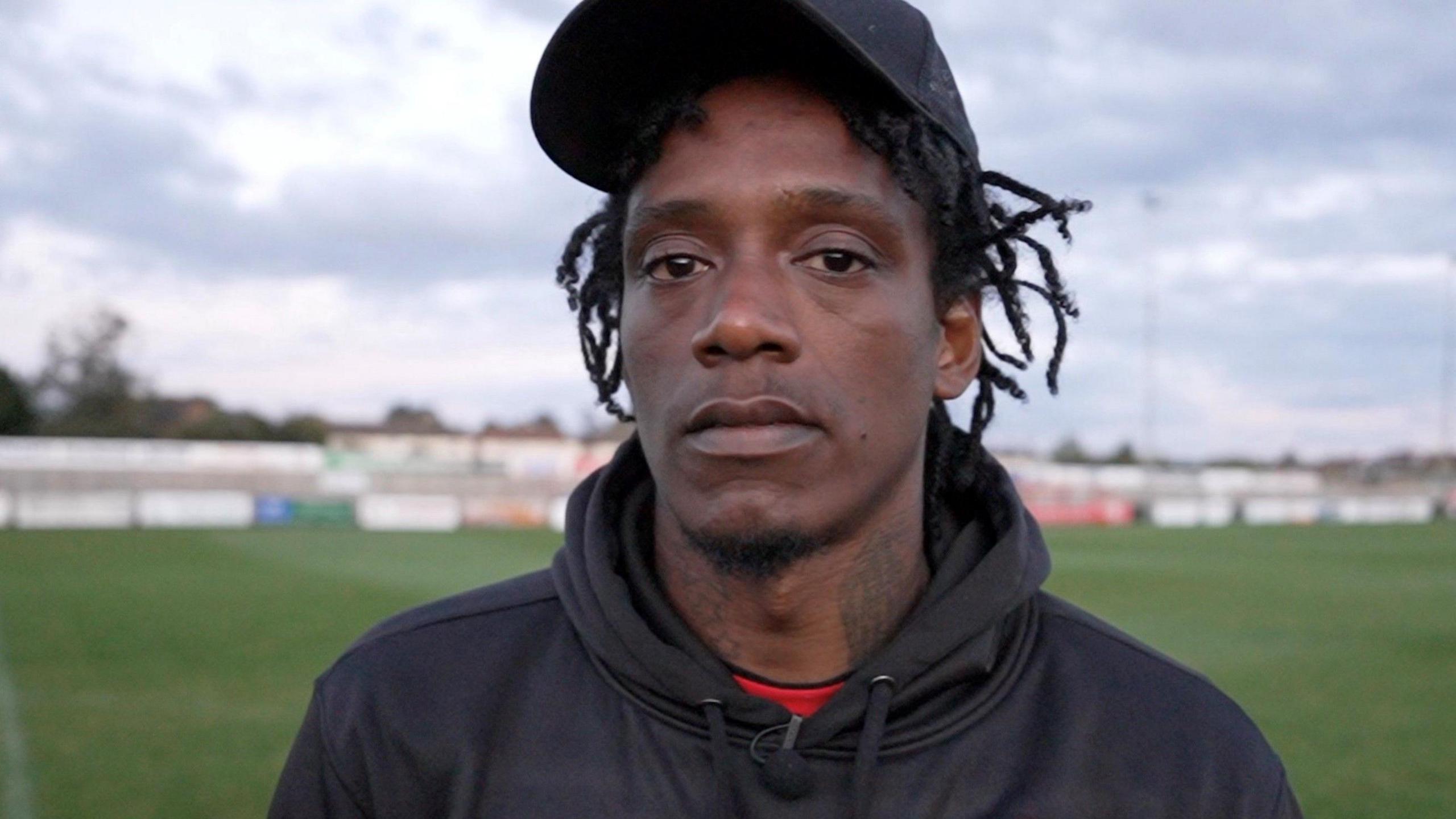 Nile Ranger pictured in a tracksuit, looking at the camera