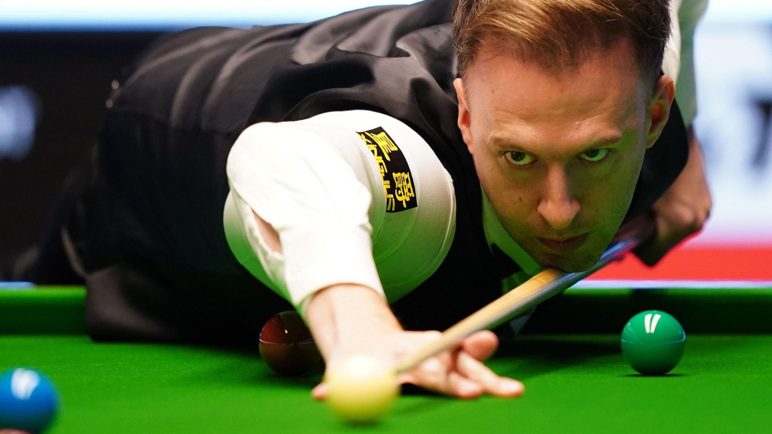 Judd Trump plays a shot at the Masters