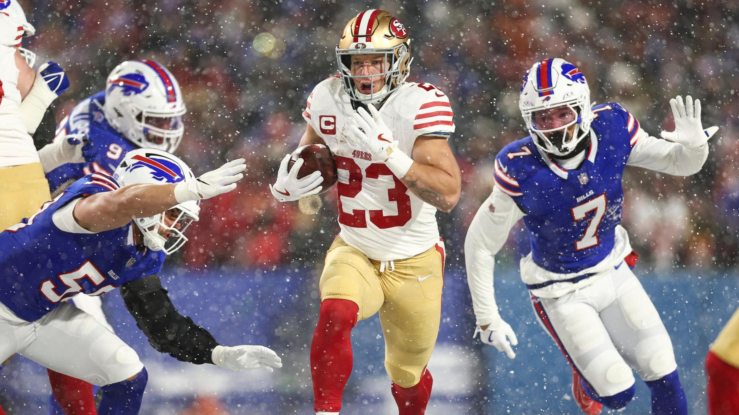 San Francisco 49ers running back Christian McCaffrey running with the ball in the snow in Buffalo during the NFL season