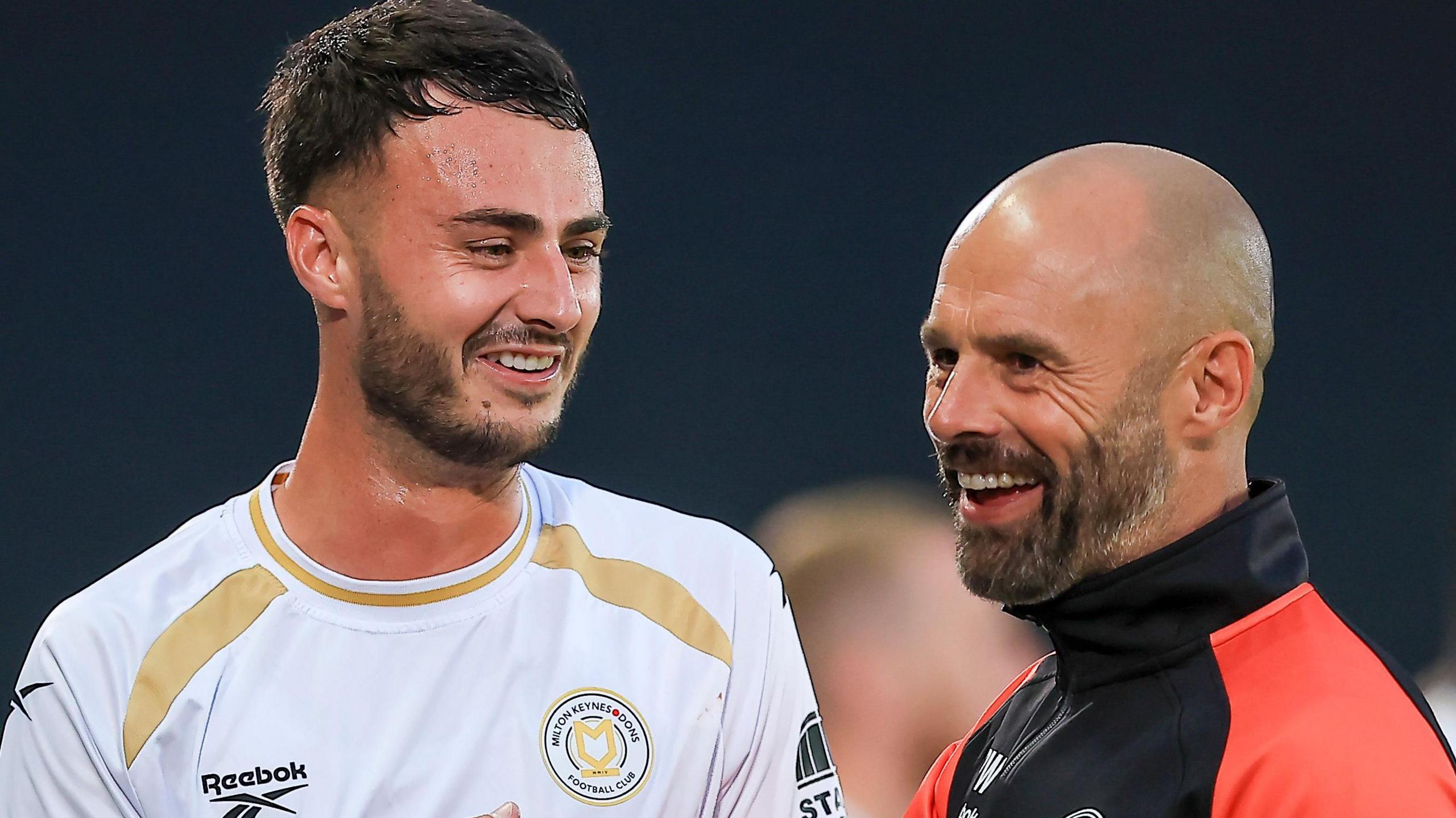 New MK Dons striker Aaron Collins with Paul Warne