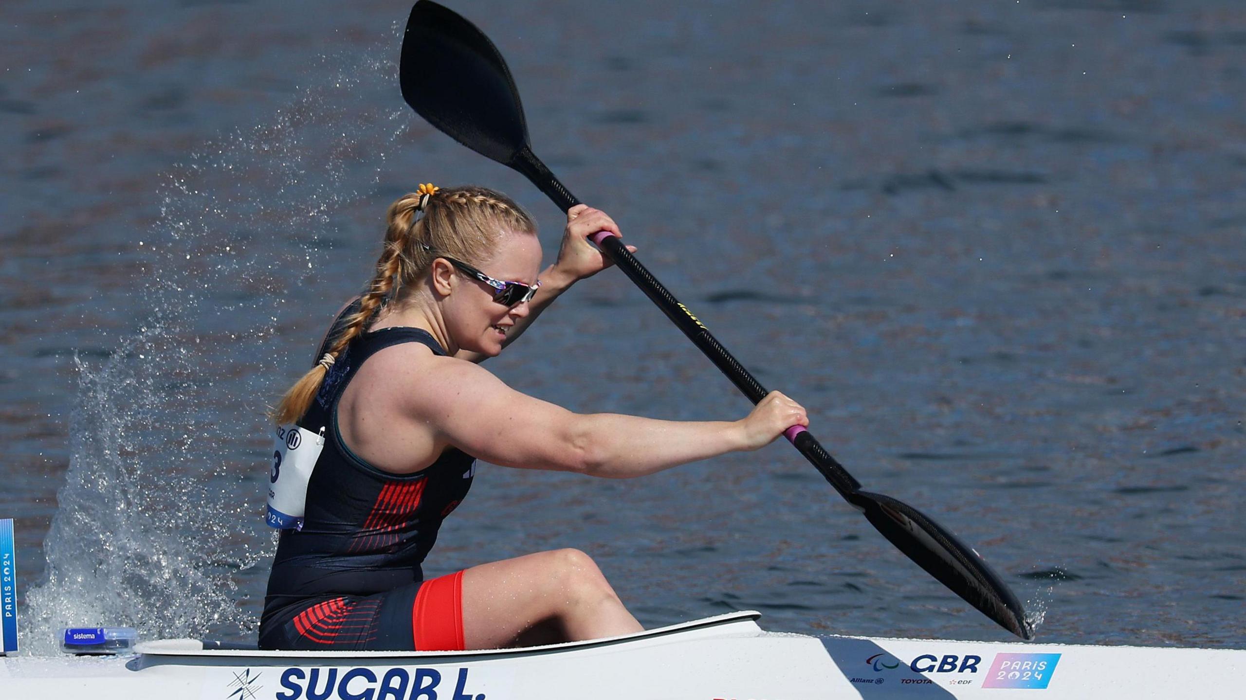 Laura Sugar races in her canoe