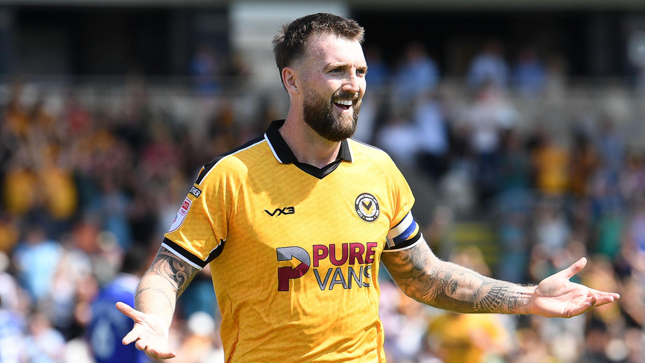 Kyle Cameron celebrates scoring for Newport County against Rochdale