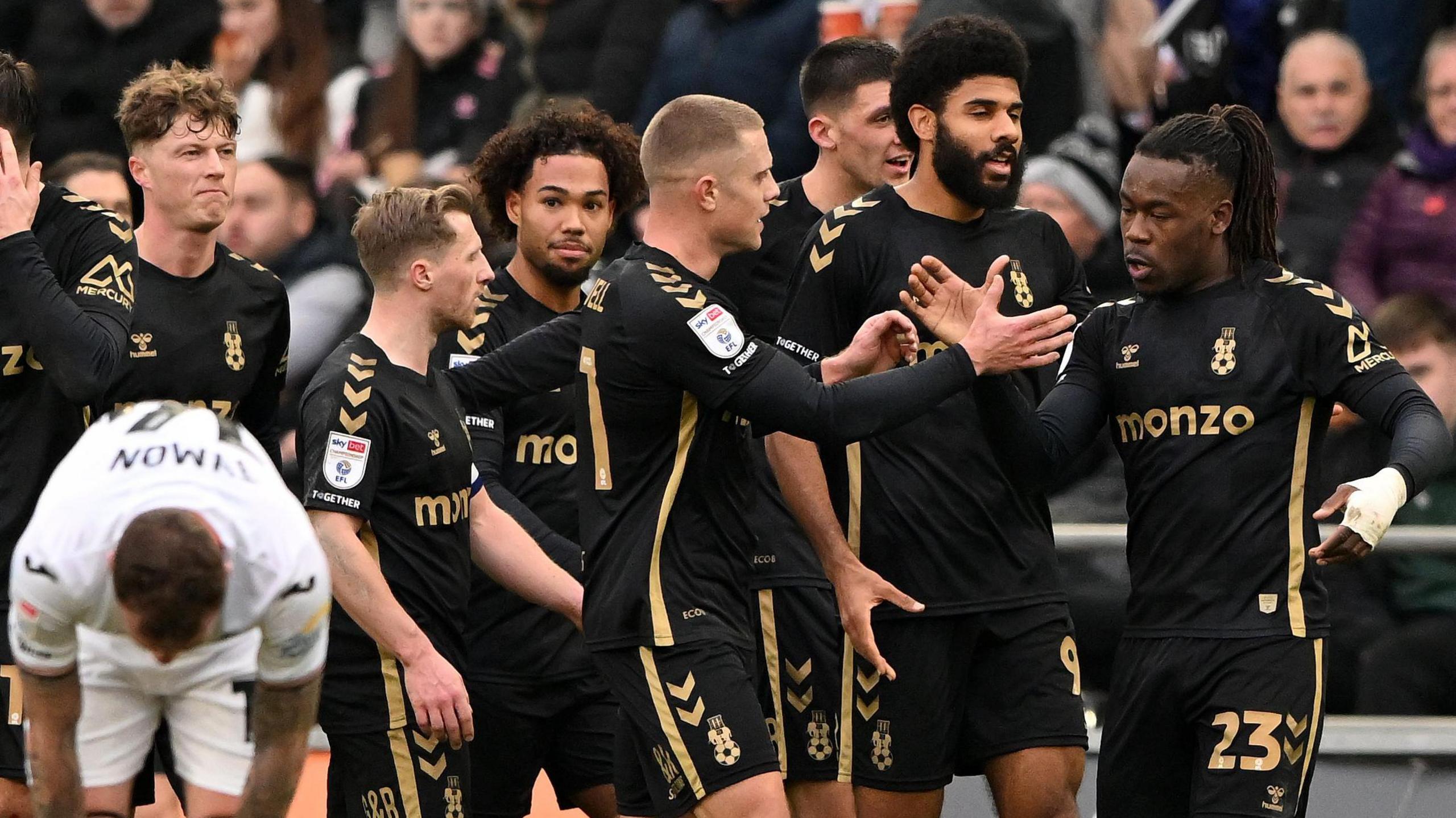 Brandon Thomas-Asante celebrates his goal with team-mates 