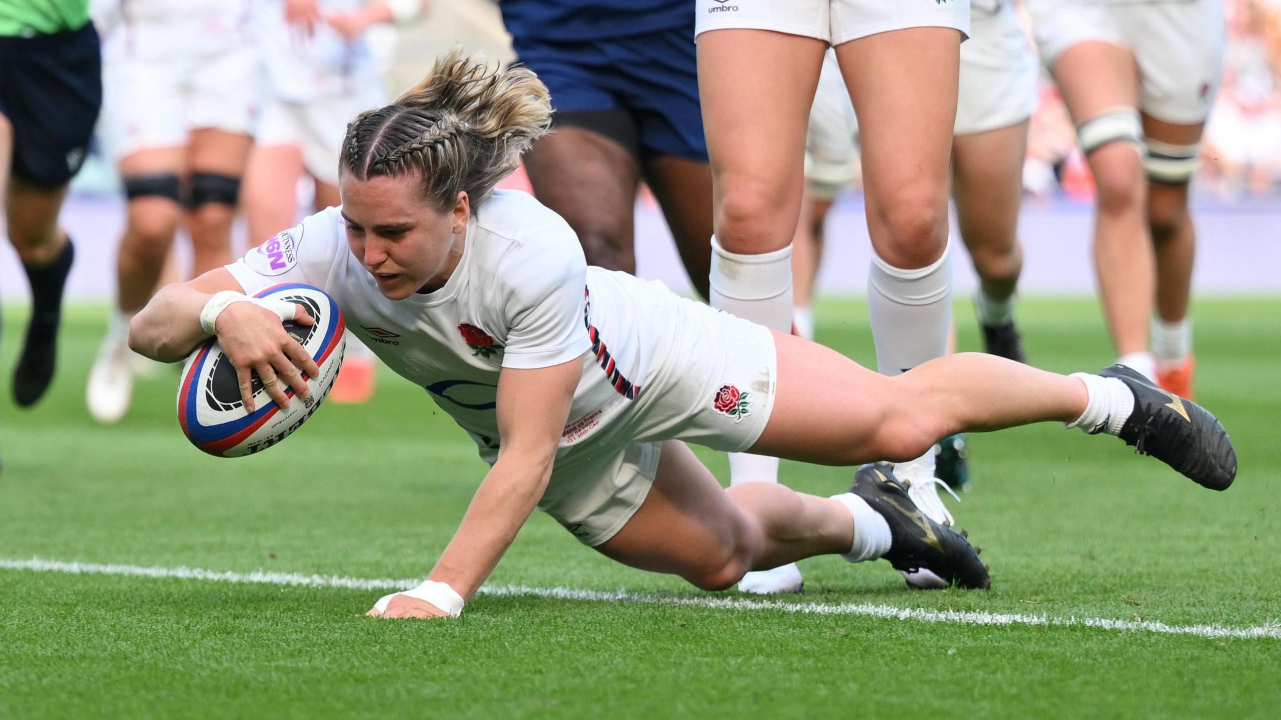 Claudia MacDonald scores a try for England