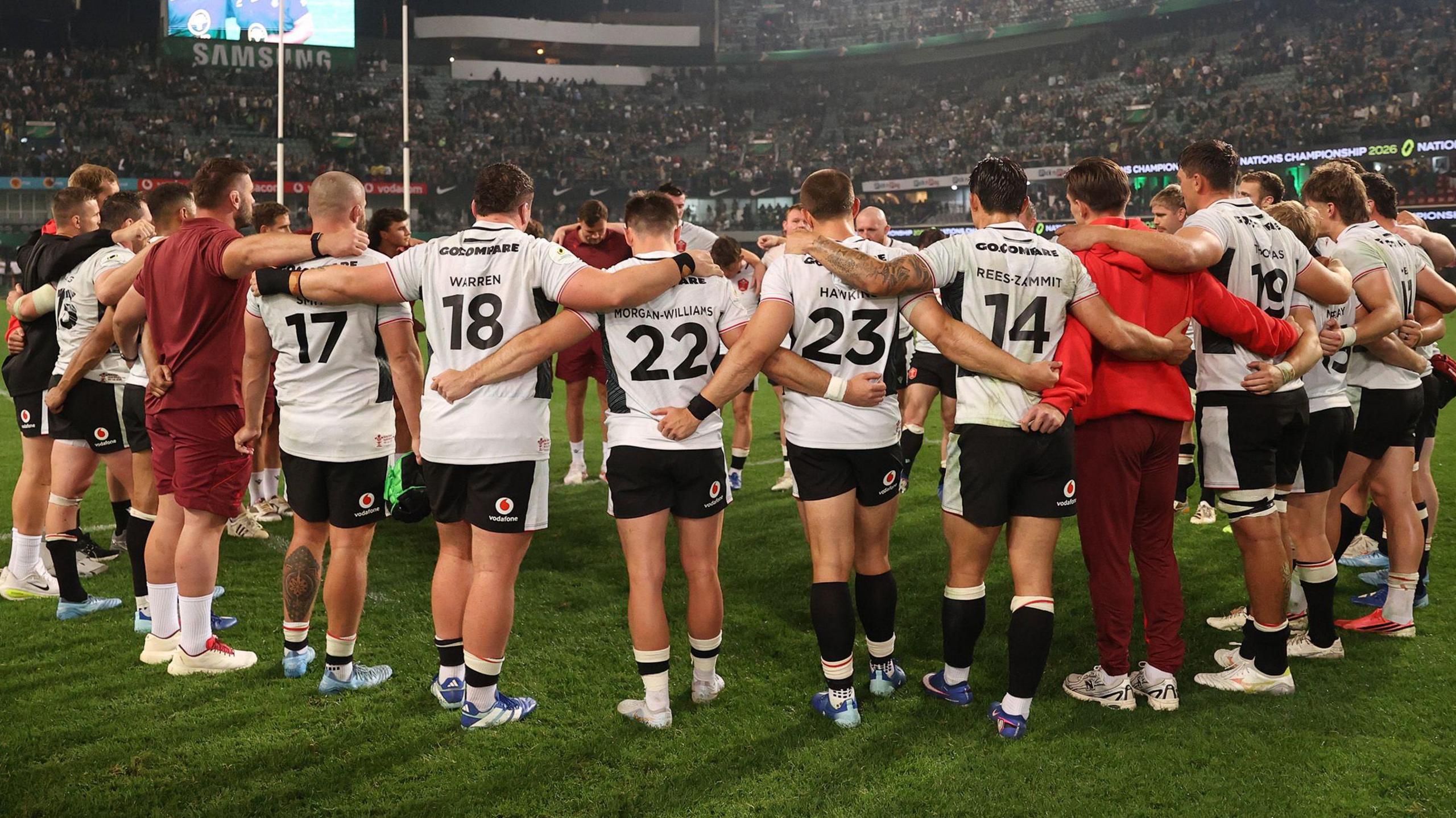Wales players in a huddle after 43-0 defeat to South Africa