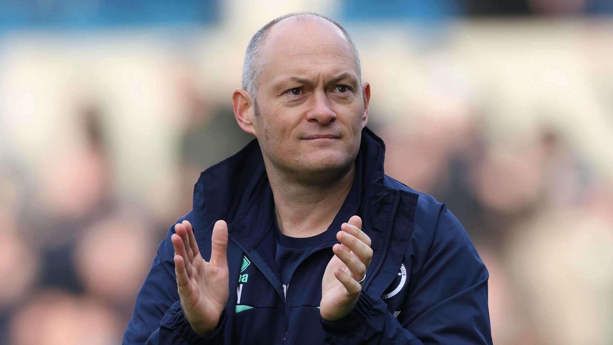 Millwall manager Alex Neil applauds the fans