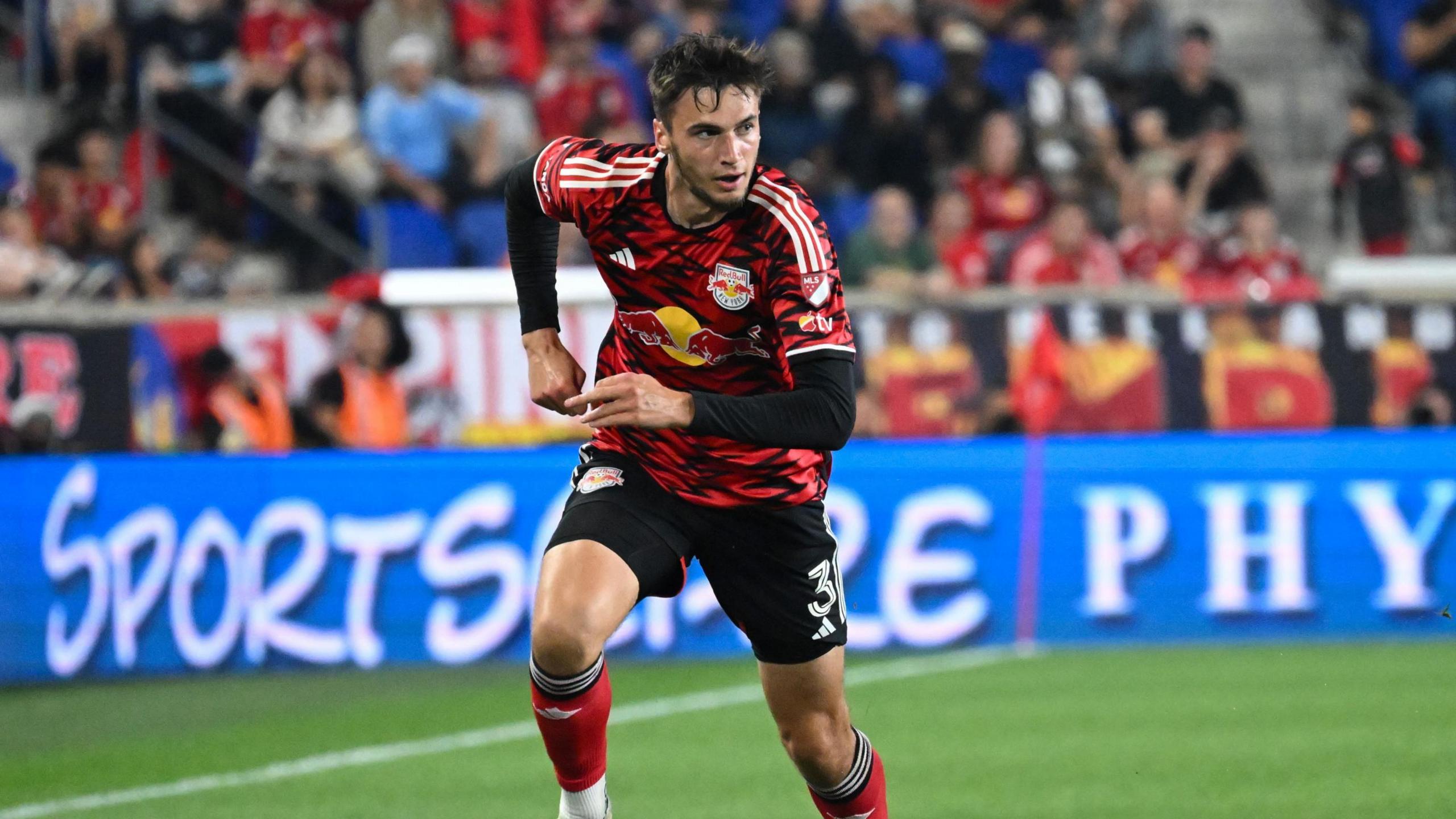 Noah Eile running on the pitch during a match for New York Red Bulls